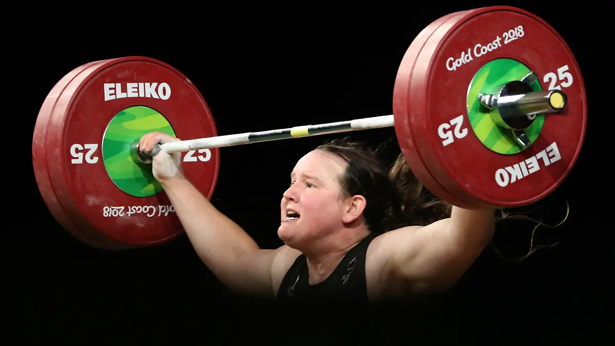 FILE - In this April 9, 2018, file photo, New Zealand's Laurel Hubbard lifts in the snatch of the women's 90kg weightlifting final at the 2018 Commonwealth Games on the Gold Coast, Australia. Hubbard, a transgender woman, is competing in weightlifting for New Zealand (AP Photo/Mark Schiefelbein, File)