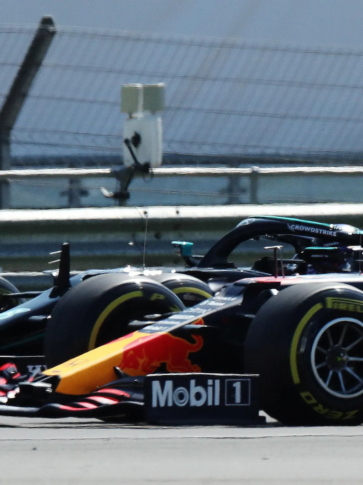 FILE PHOTO: Formula One F1 - British Grand Prix - Silverstone Circuit, Silverstone, Britain - July 18, 2021 Red Bull's Max Verstappen leads at the start of the race ahead of Mercedes' Lewis Hamilton REUTERS/Peter Cziborra/File Photo
