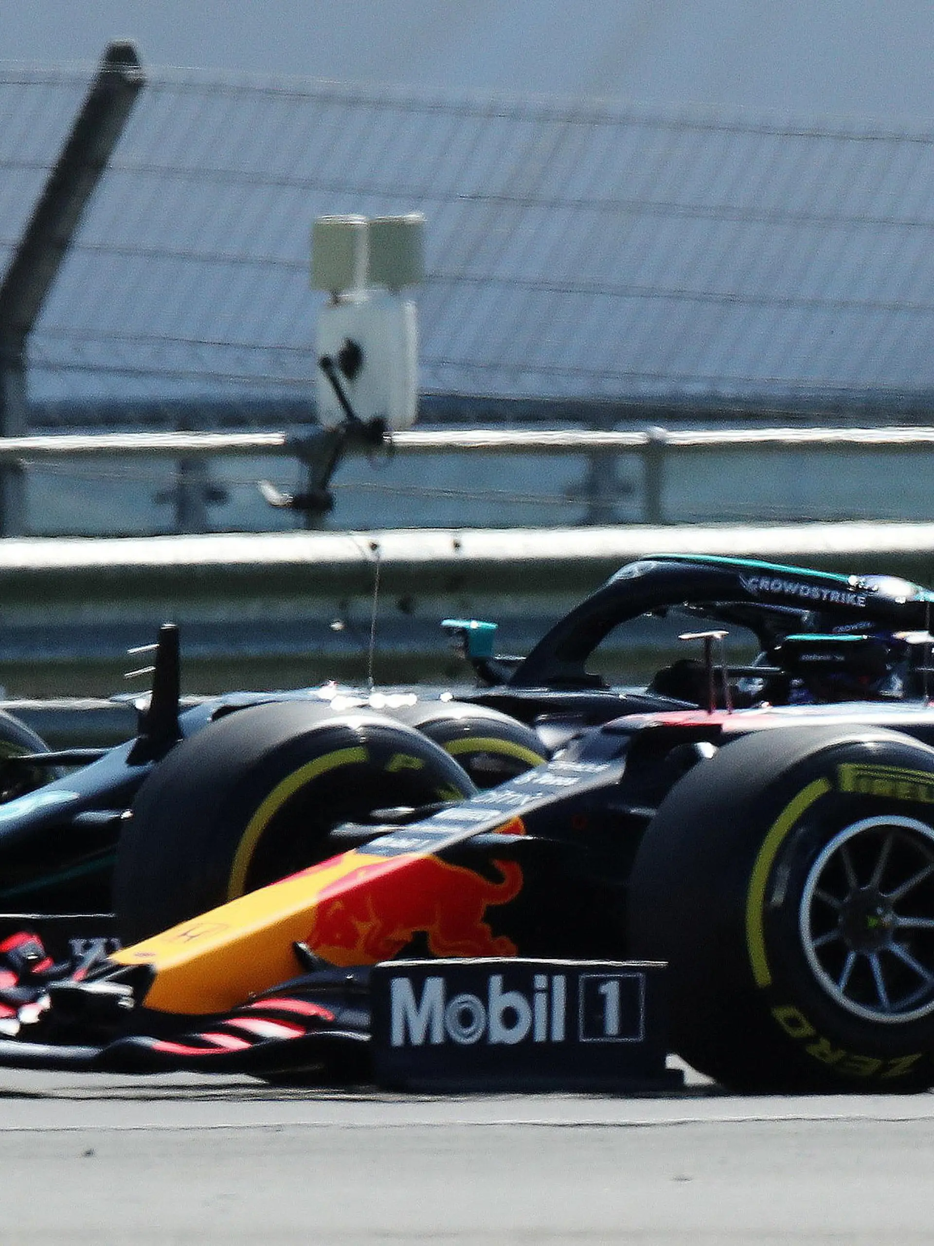 FILE PHOTO: Formula One F1 - British Grand Prix - Silverstone Circuit, Silverstone, Britain - July 18, 2021 Red Bull's Max Verstappen leads at the start of the race ahead of Mercedes' Lewis Hamilton REUTERS/Peter Cziborra/File Photo