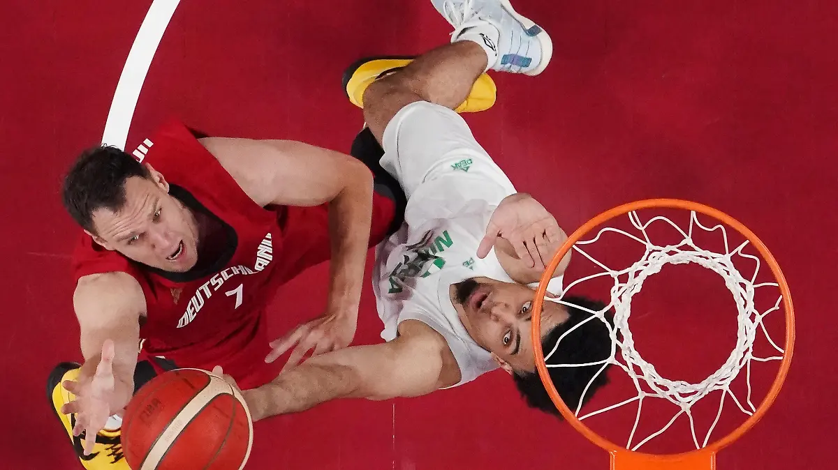 Tokyo 2020 Olympics - Basketball - Men - Group B - Nigeria v Germany - Saitama Super Arena, Saitama, Japan - July 28, 2021. Johannes Voigtmann of Germany in action with Jordan Nwora of Nigeria REUTERS/Brian Snyder