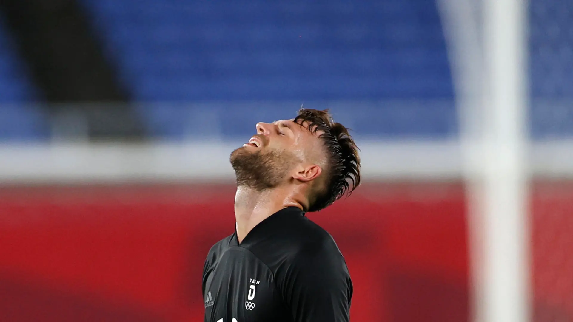 Tokyo 2020 Olympics - Soccer Football - Men - Group D - Saudi Arabia v Germany - International Stadium Yokohama, Yokohama, Japan - July 25, 2021. Eduard Loewen of Germany reacts at the end of the match REUTERS/Phil Noble