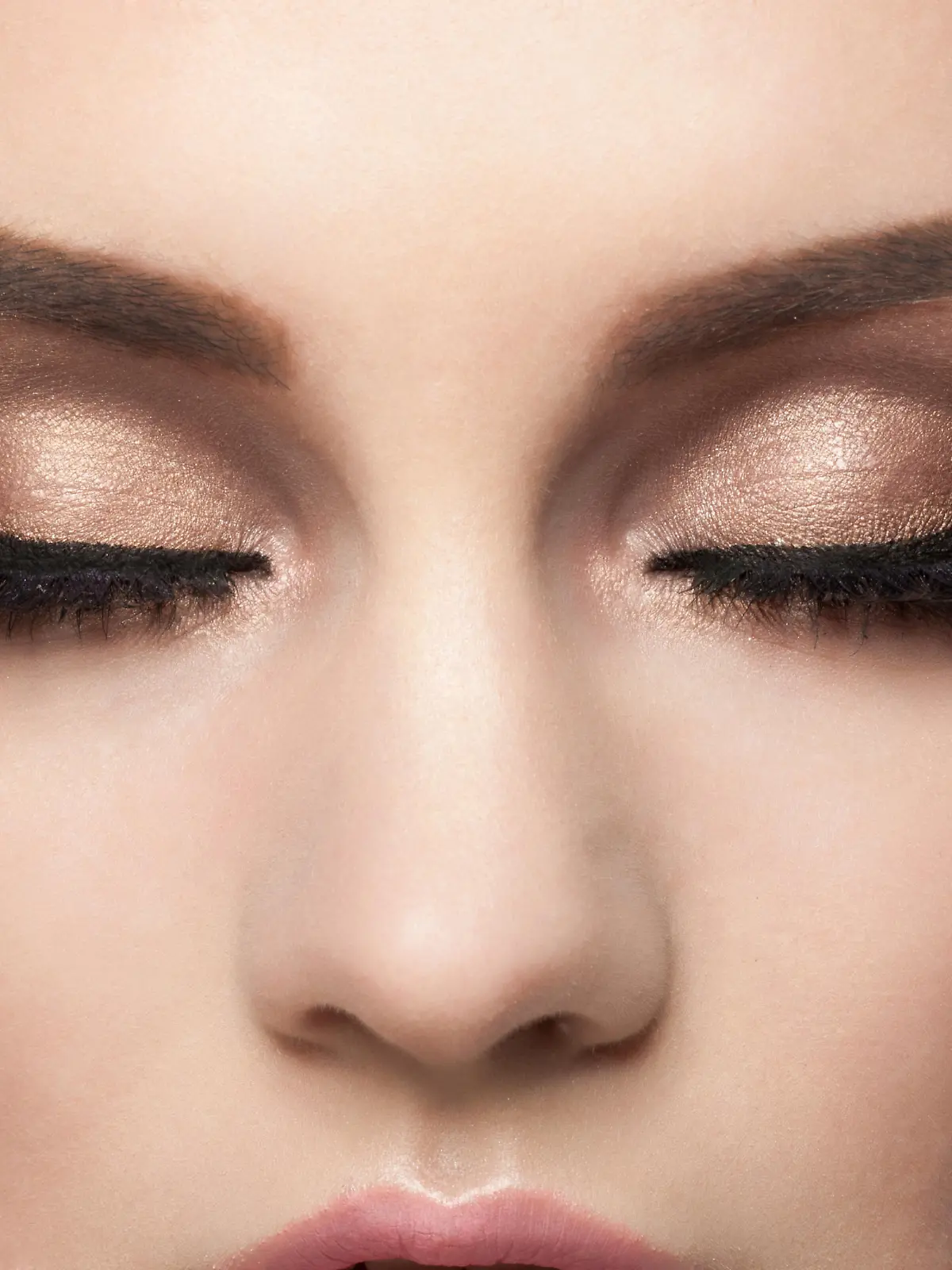 Closeup image of woman closed eyes with beautiful bright makeup. Makeup with eyeliner and falce eyelashes