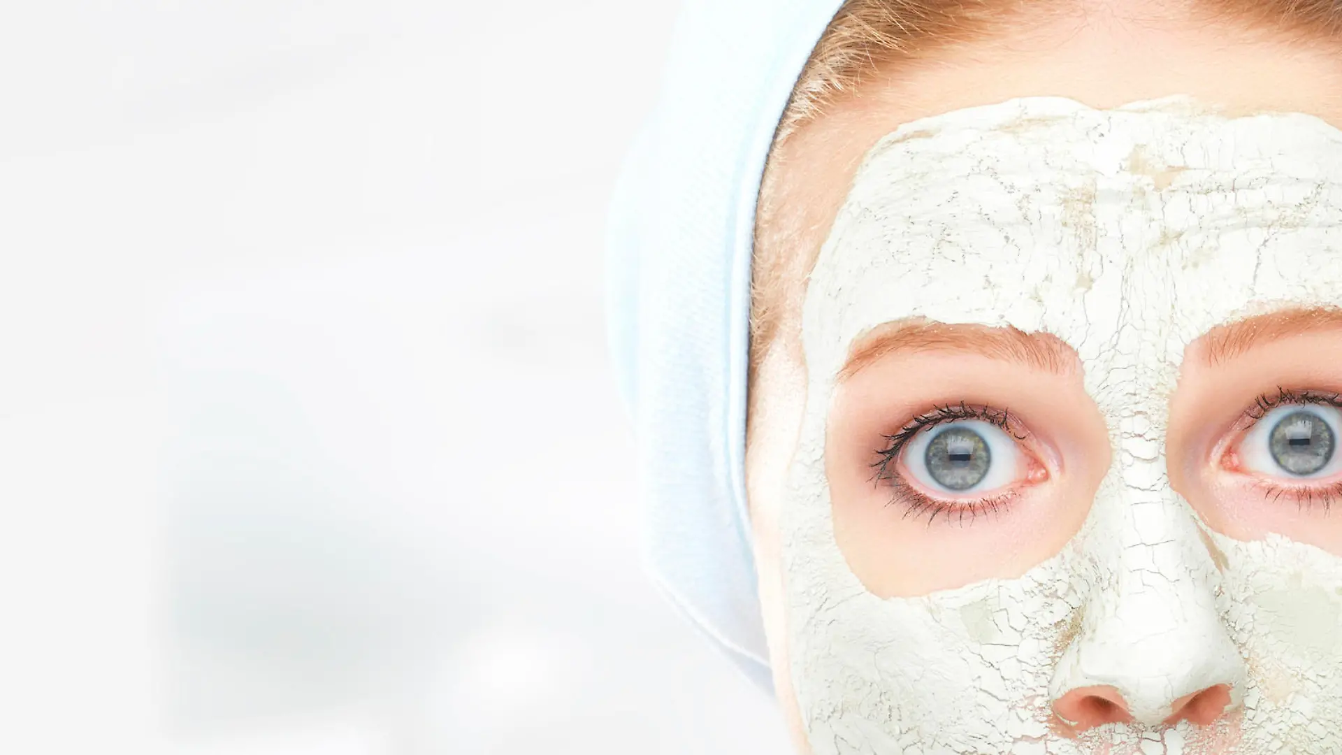 funny young woman and a facial skin care mask