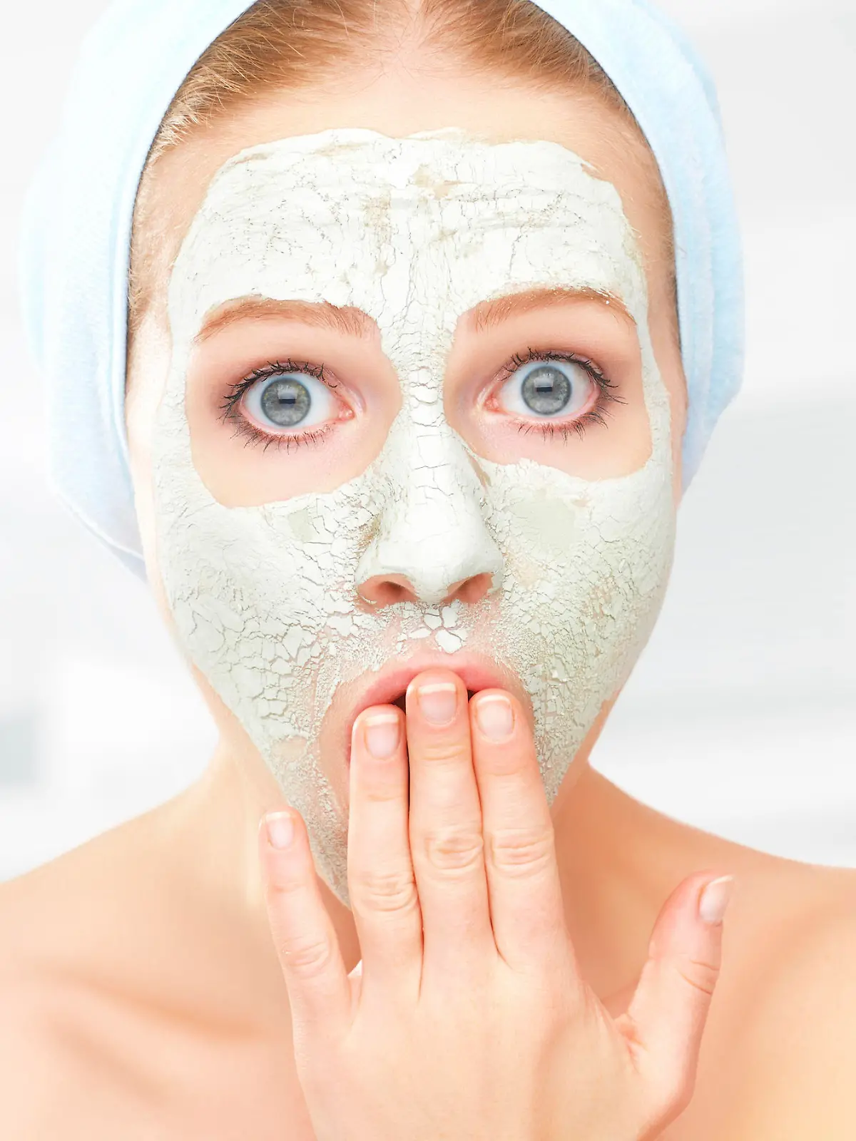 funny young woman and a facial skin care mask