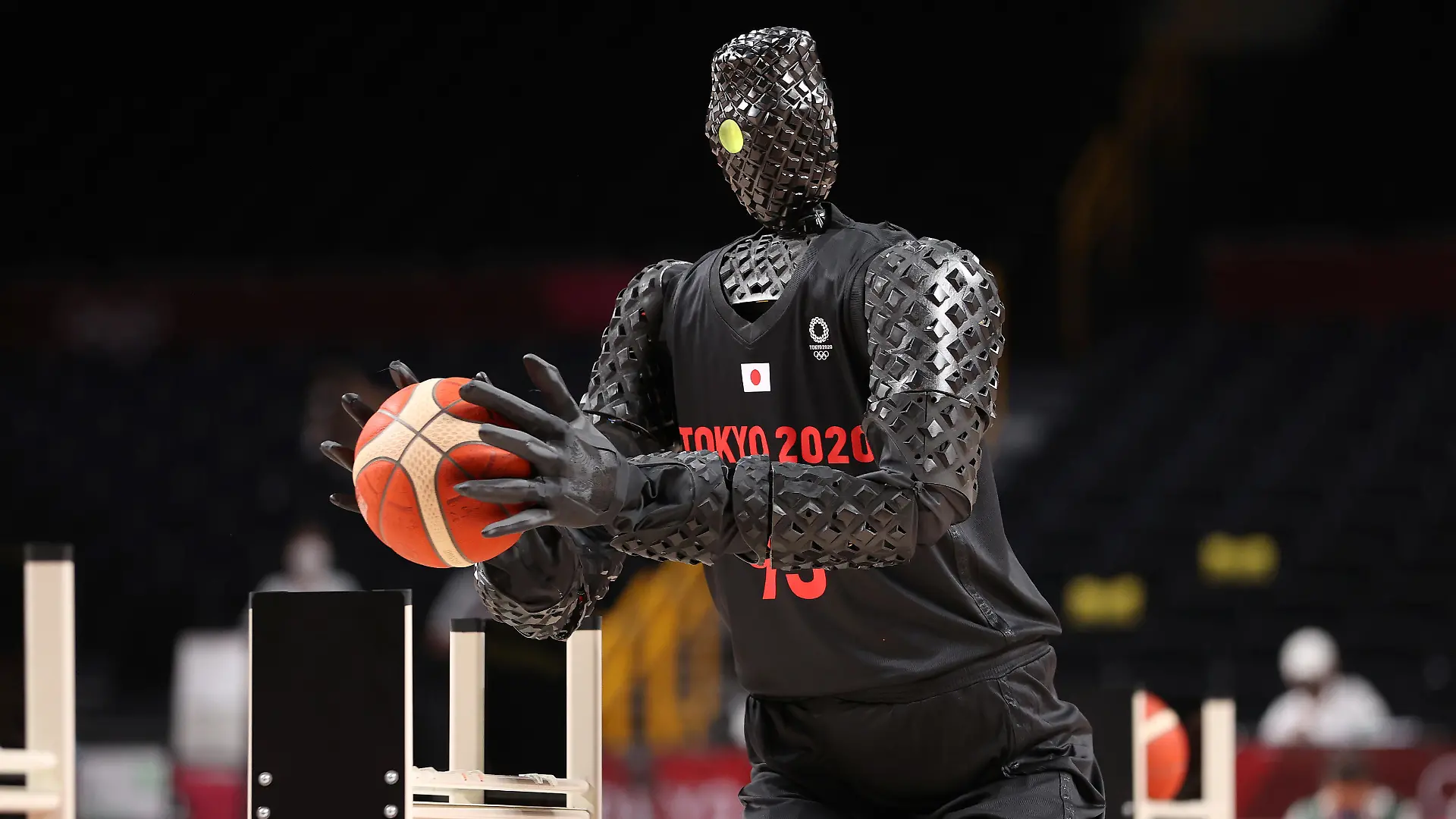 SAITAMA, JAPAN - JULY 25: A robot plays basketball during halftime of the Men's Preliminary Round Group B game between the United States and France on day two of the Tokyo 2020 Olympic Games at Saitama Super Arena on July 25, 2021 in Saitama, Japan. (Photo by Gregory Shamus/Getty Images)
