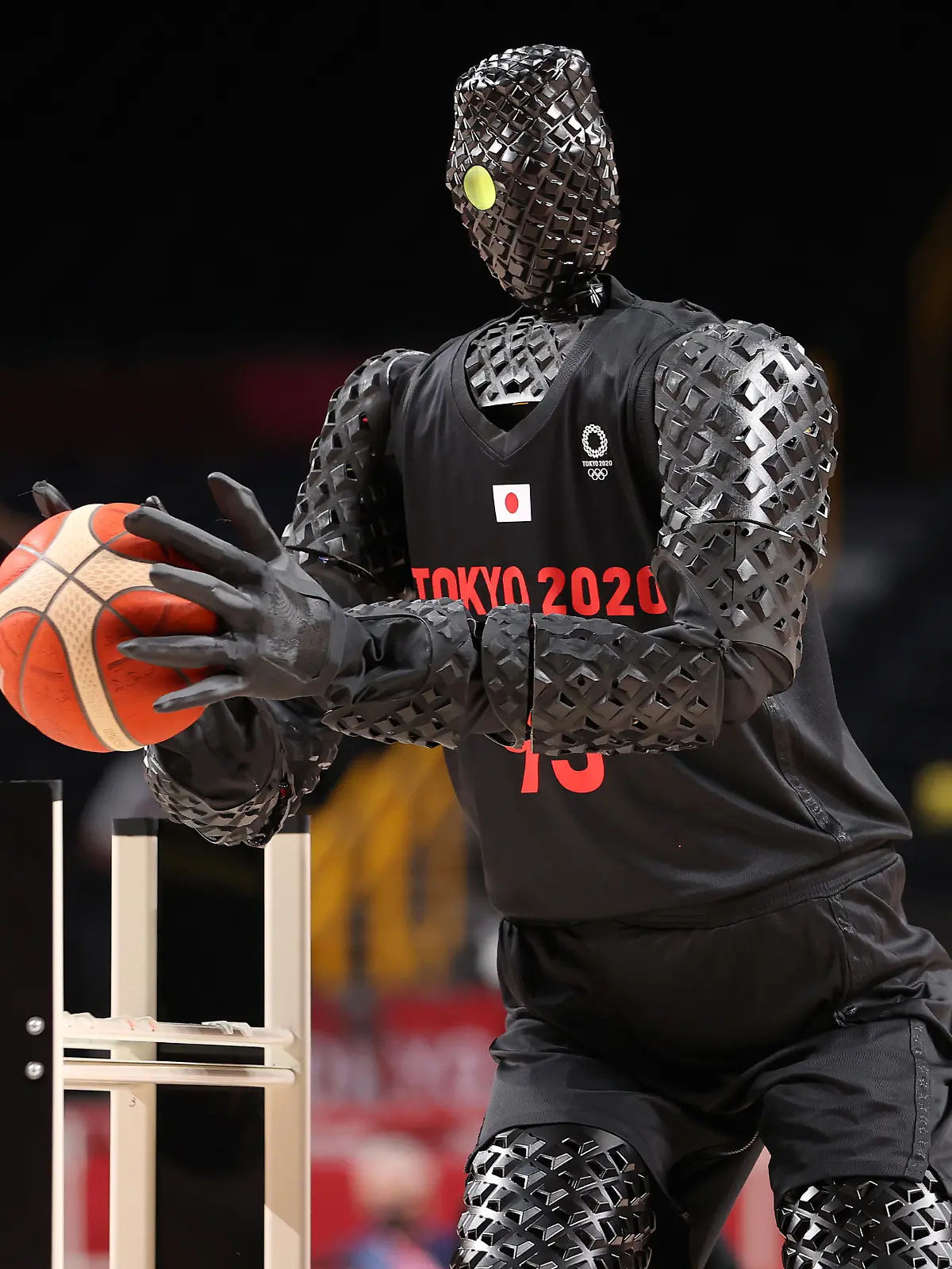 SAITAMA, JAPAN - JULY 25: A robot plays basketball during halftime of the Men's Preliminary Round Group B game between the United States and France on day two of the Tokyo 2020 Olympic Games at Saitama Super Arena on July 25, 2021 in Saitama, Japan. (Photo by Gregory Shamus/Getty Images)