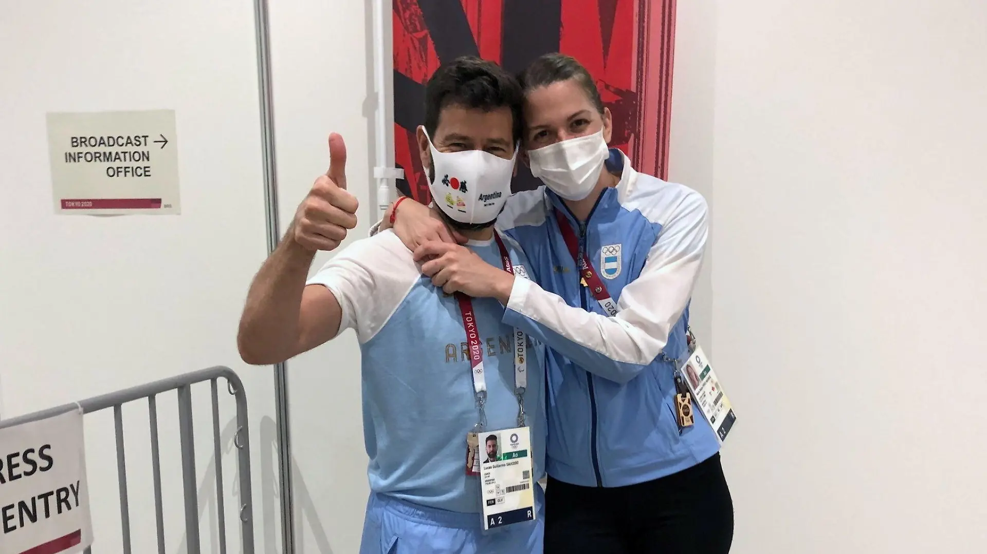Argentine fencer Maria Belen Perez Maurice hugs her coach of 17 years, Lucas Guillermo Saucedo, after he proposed marriage to her on the sidelines of the Olympic fencing at Makuhari Messe Hall in Chiba, Japan July 26, 2021. Picture taken July 26, 2021. REUTERS/Sakura Murakami