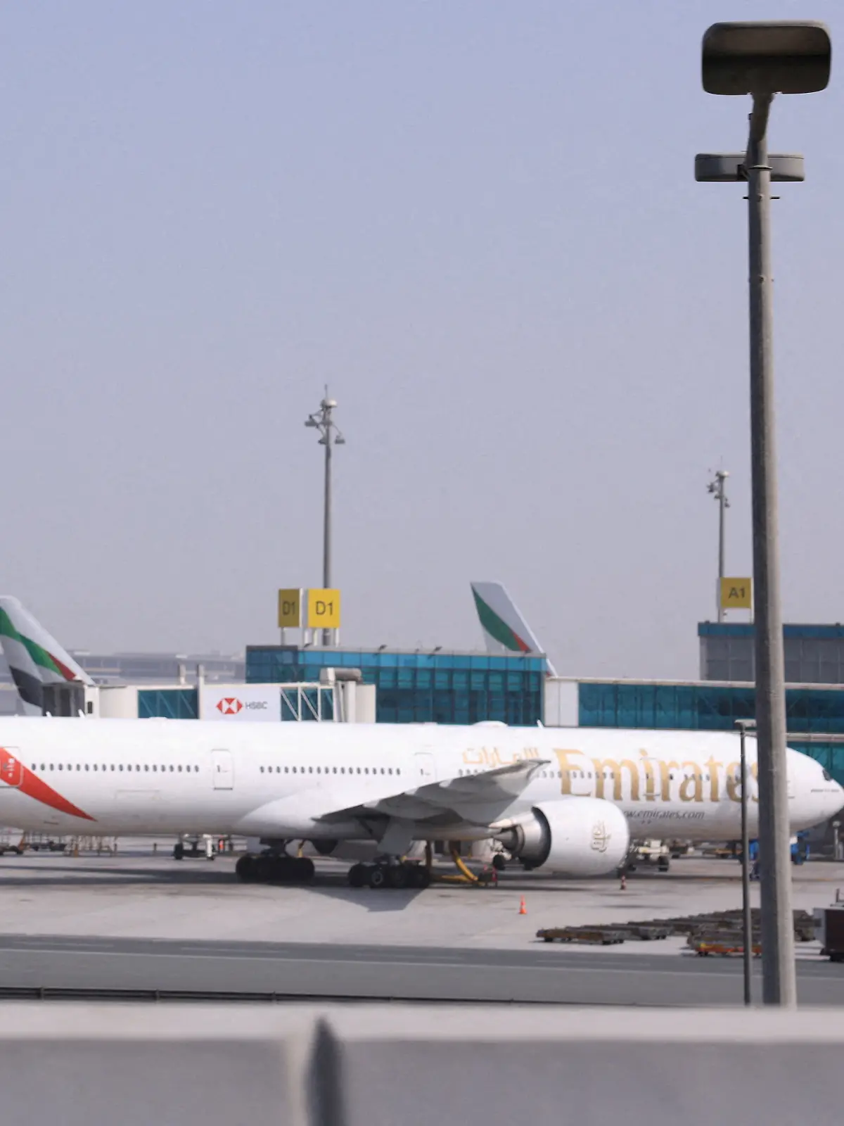 Planes are parked at Terminal 3 of the Dubai International Airport