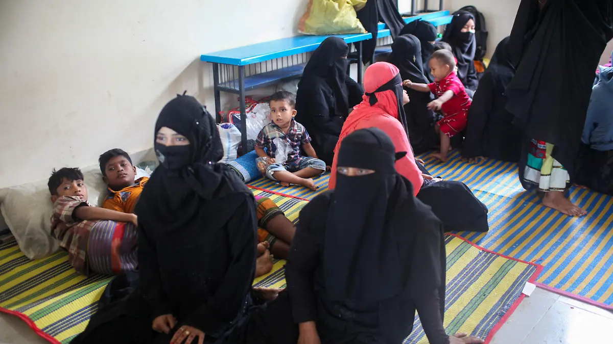 May 14, 2023, Dhaka, Dhaka, Bangladesh: Women take shelter with their children in Shahpori island on the outskirts of Teknaf, on May 14, 2023, ahead of Cyclone Mocha's landfall. The maritime port in Cox's Bazar and Shahpori Island has been asked to hoist cautionary signal (Great Danger Signal) 10 as cyclone Mocha has intensified into an extremely severe cyclonic storm over the east central Bay of Bengal. (Credit Image: © Abu Sufian Jewel/ZUMA Press Wire