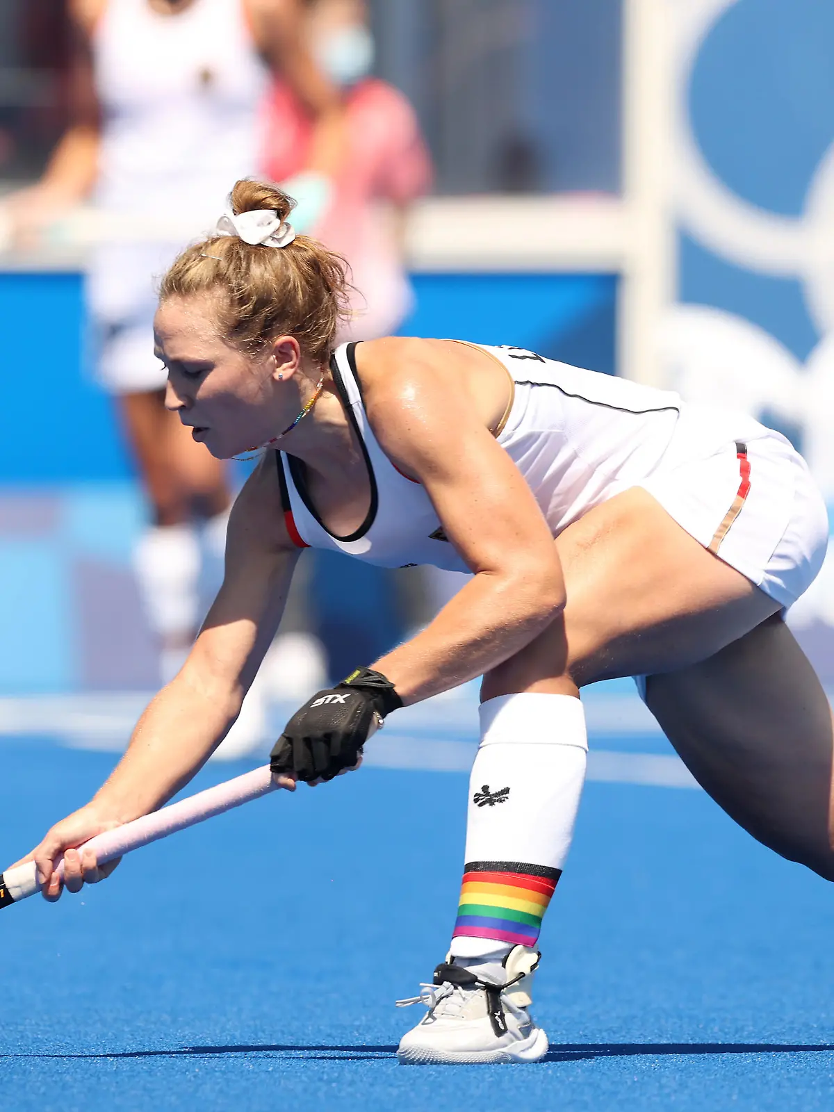 TOKYO, JAPAN - JULY 25: Nike Lorenz #4 of Team Germany passes the ball during the Women's Pool A match against Team Great Britain on day two of the Tokyo 2020 Olympic Games at Oi Hockey Stadium on July 25, 2021 in Tokyo, Japan. (Photo by Alexander Hassenstein/Getty Images)