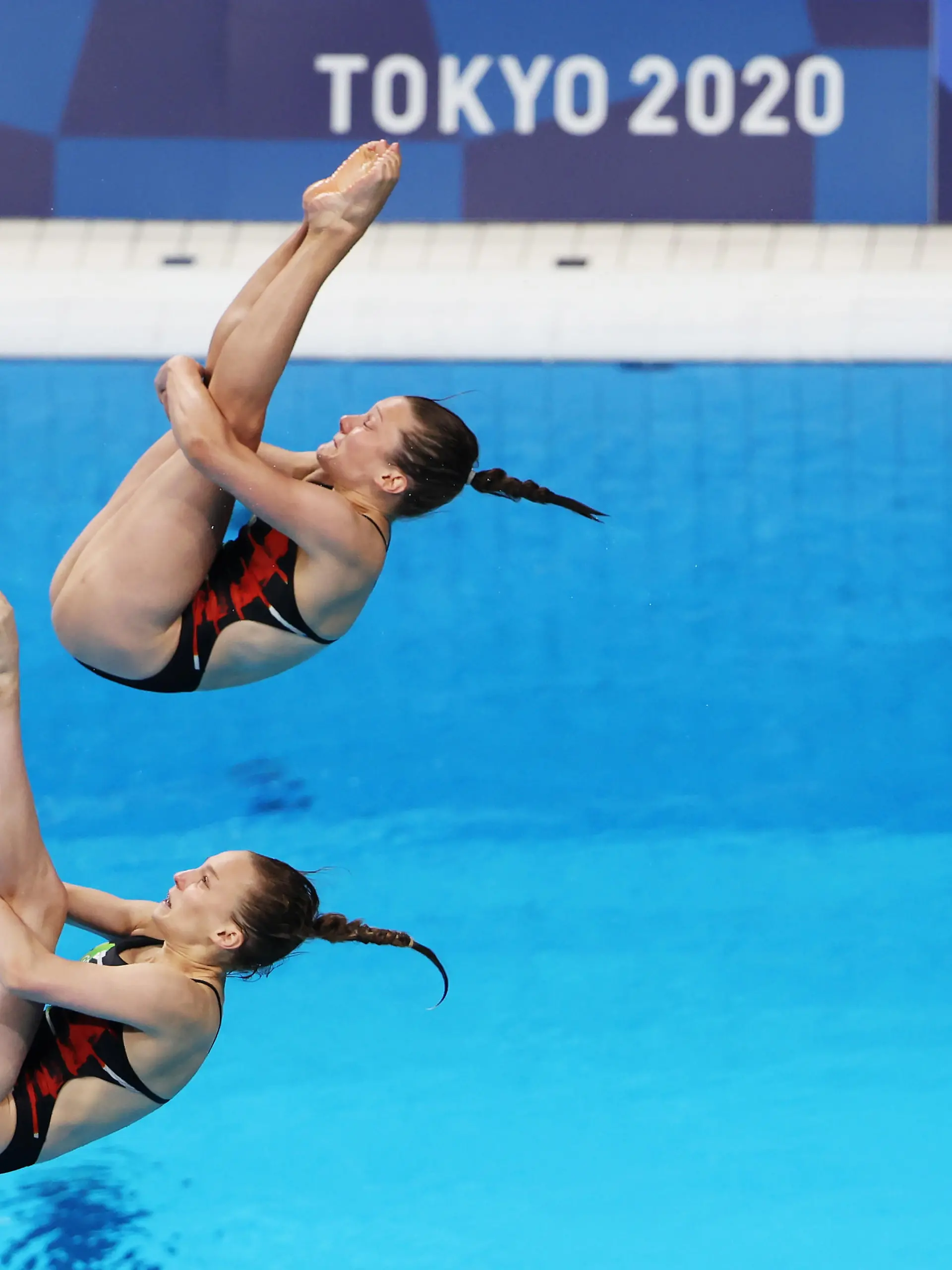 TOKYO, JAPAN - JULY 25: Lena Hentschel and Tina Punzel of Team Germany compete during Women's 3m Springboard Finals on day two of the Tokyo 2020 Olympic Games at Tokyo Aquatics Centre on July 25, 2021 in Tokyo, Japan. (Photo by Tom Pennington/Getty Images)