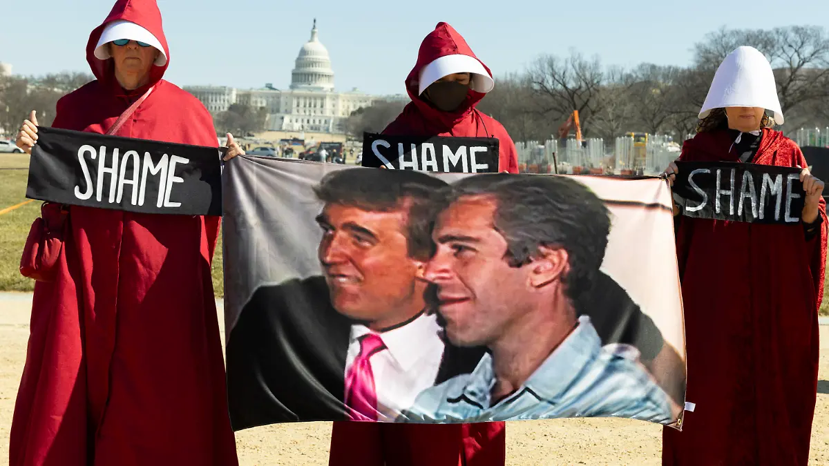 Demonstrators dressed as handmaids from The Handmaid's Tale hold a Trump-Epstein sign during the ''March 4 Democracy'' rally on the National Mall in Washington, DC, on February 28, 2026. On this day, US President Donald Trump announces that the United States and Israel launch major military strikes on Iran that kill Iran's Supreme Leader Ayatollah Ali Khamenei. (Photo by Aashish Kiphayet/NurPhoto)