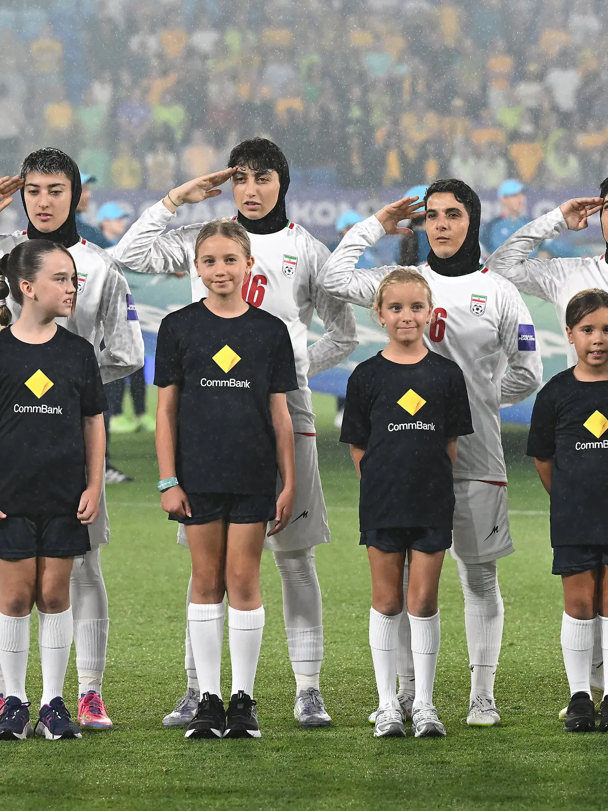 Iran players react during their national anthem ahead of the Women's Asia Cup soccer match between Australia and Iran in Robina, Australia, Thursday, March 5, 2026. (Dave Hunt/AAPImage via AP)
