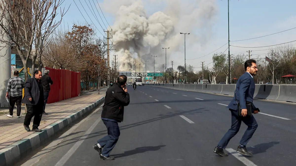 People run as smoke rises following an explosion, amid the U.S.-Israeli conflict with Iran, in Tehran, Iran, March 5, 2026. Majid Asgaripour/WANA (West Asia News Agency) via REUTERS ATTENTION EDITORS - THIS PICTURE WAS PROVIDED BY A THIRD PARTY        TPX IMAGES OF THE DAY