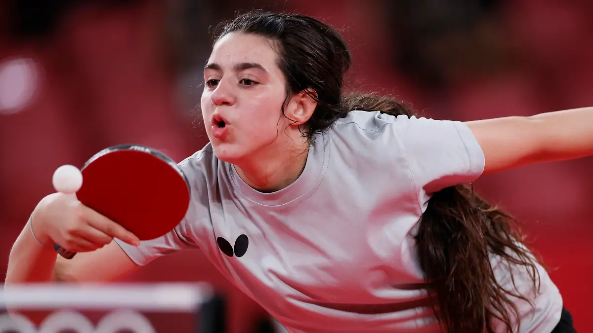 TOKYO, JAPAN - JULY 24: Hend Zaza of Team Syria in action during her women's singles preliminary round table tennis match on day one of the Tokyo 2020 Olympic Games at Tokyo Metropolitan Gymnasium on July 24, 2021 in Tokyo, Japan. (Photo by Steph Chambers/Getty Images)
