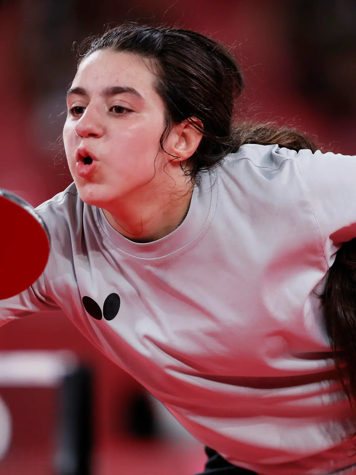 TOKYO, JAPAN - JULY 24: Hend Zaza of Team Syria in action during her women's singles preliminary round table tennis match on day one of the Tokyo 2020 Olympic Games at Tokyo Metropolitan Gymnasium on July 24, 2021 in Tokyo, Japan. (Photo by Steph Chambers/Getty Images)