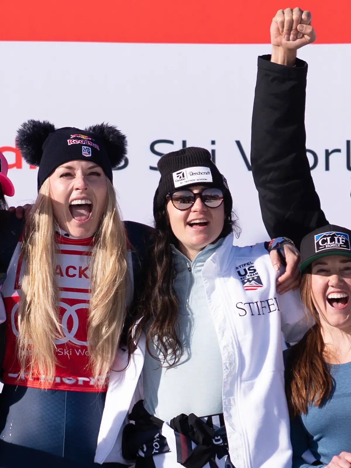 First placed Lindsey Vonn of the United States, second from left, celebrates her win with team USA and her coach and former Norwegian skiier Aksel Lund Svindal, right, after the women's Downhill race at the Alpine Skiing FIS Ski World Cup, in St. Moritz, Switzerland, Friday, December 12, 2025.(KEYSTONE/Claudio Thoma)