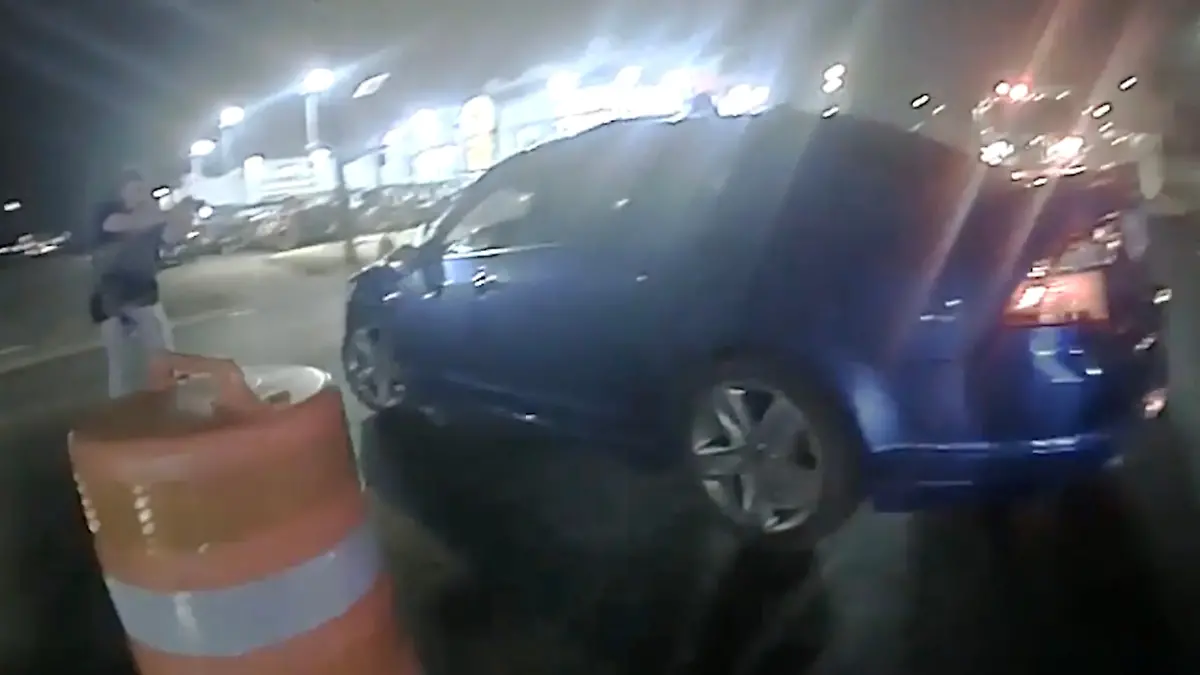 In this image from video provided by the Texas Department of Public Safety, Homeland Security Investigations Special Agent Jack Stevens points his weapon at Ruben Ray Martinez in his vehicle at a roadblock in South Padre Island, Texas, on March 15, 2025. (Officer Miguel Leal/Texas Department of Public Safety via AP)