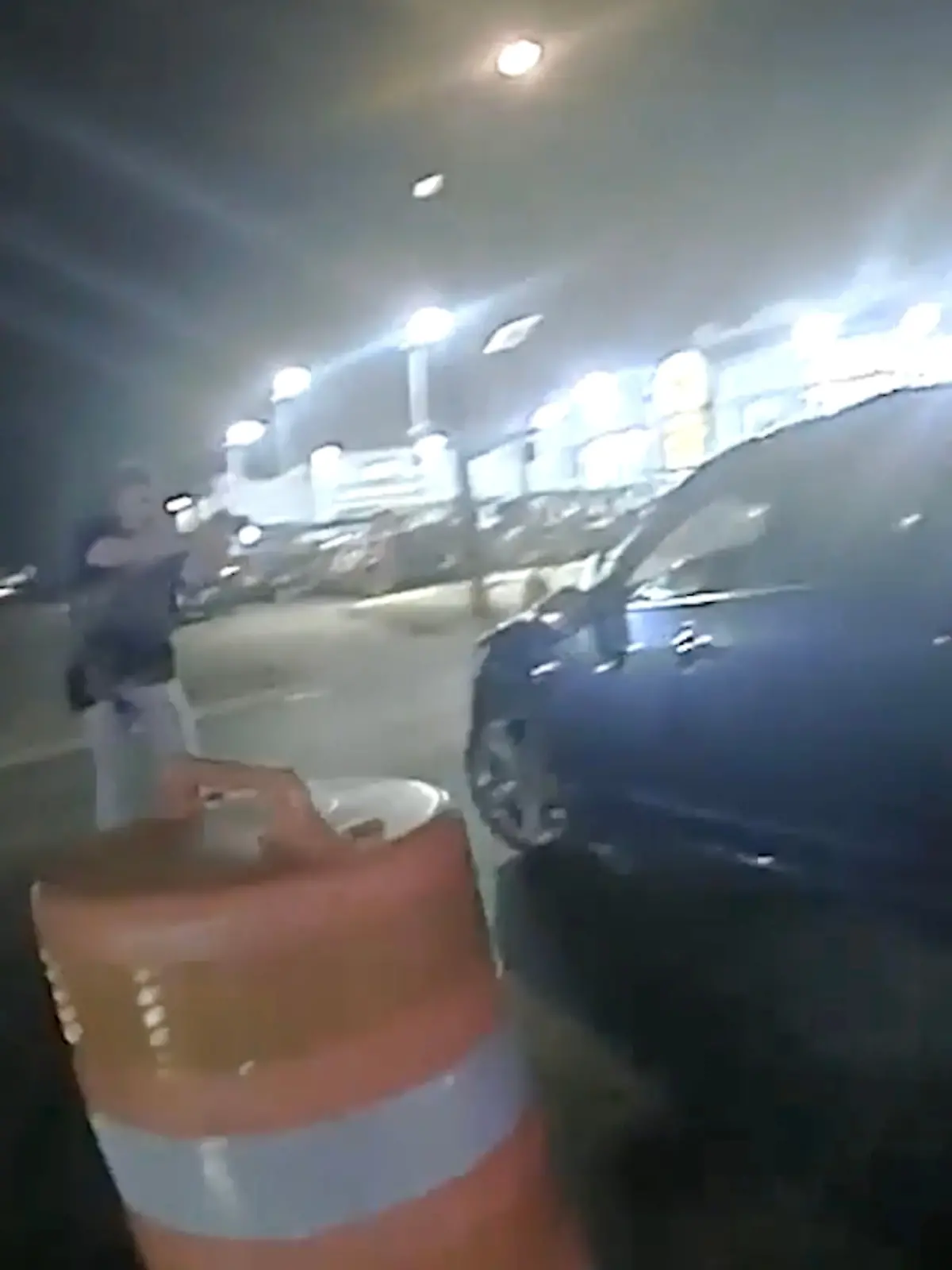In this image from video provided by the Texas Department of Public Safety, Homeland Security Investigations Special Agent Jack Stevens points his weapon at Ruben Ray Martinez in his vehicle at a roadblock in South Padre Island, Texas, on March 15, 2025. (Officer Miguel Leal/Texas Department of Public Safety via AP)