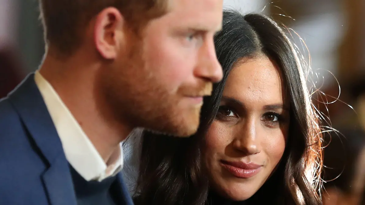 ARCHIV - 13.02.2018, Großbritannien, Edinburgh: Meghan, Herzogin von Sussex und ihr Mann, Prinz Harry nehmen an einem Empfang für junge Leute im Holyroodhouse Palast in Edinburgh teil. (zu dpa "Harry und Meghan zum Tod Philips: «Du wirst schwer vermisst werden») Foto: Andrew Milligan/PA Wire/dpa +++ dpa-Bildfunk +++