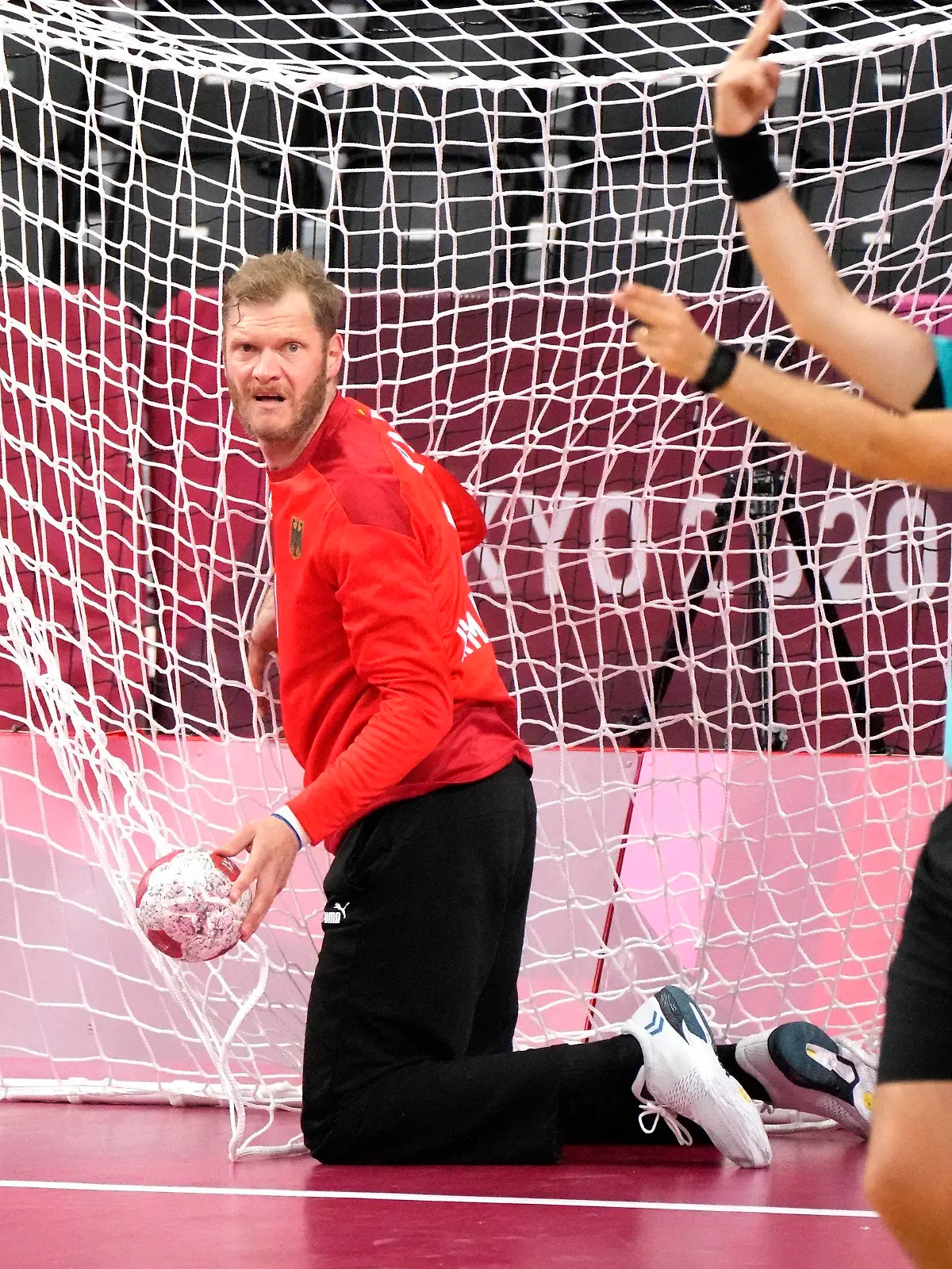 Germany's goalkeeper Johannes Bitter reacts during the men's preliminary round group A handball match between Germany and Spain at the 2020 Summer Olympics, Saturday, July 24, 2021, in Tokyo, Japan. (AP Photo/Sergei Grits)