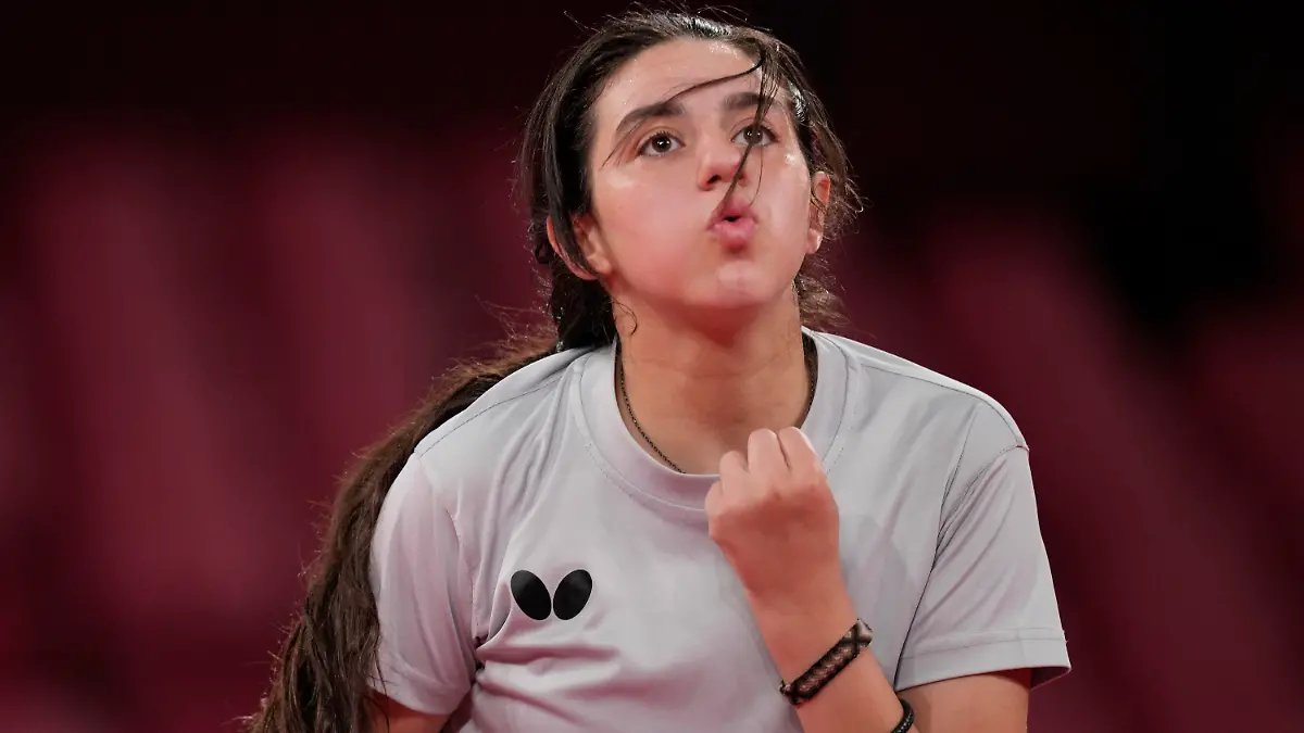 24.07.2021, Japan, Tokio: Tischtennis: Olympia, Vorkampf, Einzel, Frauen, Vorrunde, Liu (Österreich) - Zaza (Syrien) im Tokyo Metropolitan Gymnasium. Hend Zaza reagiert. Foto: Kin Cheung/AP/dpa +++ dpa-Bildfunk +++