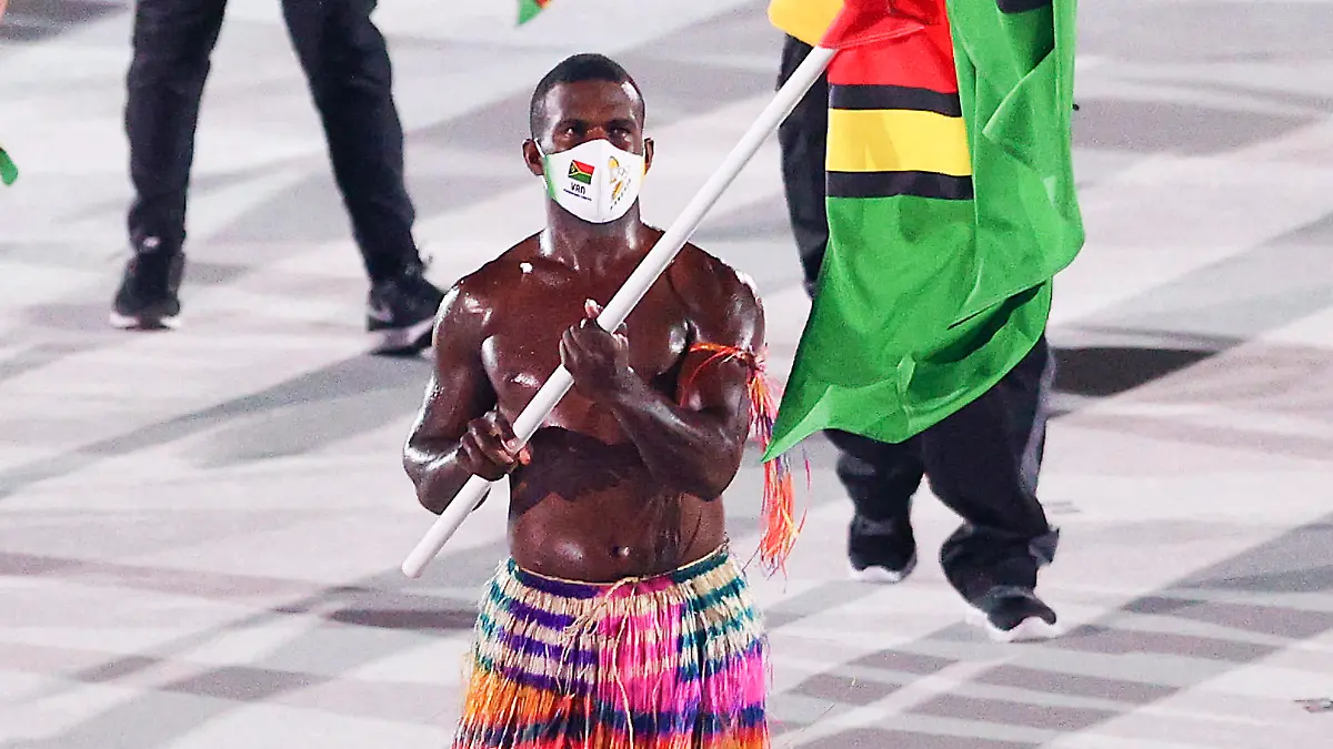 TOKYO, JAPAN - JULY 23: Flag bearer Riilio Rii of Team Vanuatu during the Opening Ceremony of the Tokyo 2020 Olympic Games at Olympic Stadium on July 23, 2021 in Tokyo, Japan. (Photo by Patrick Smith/Getty Images)