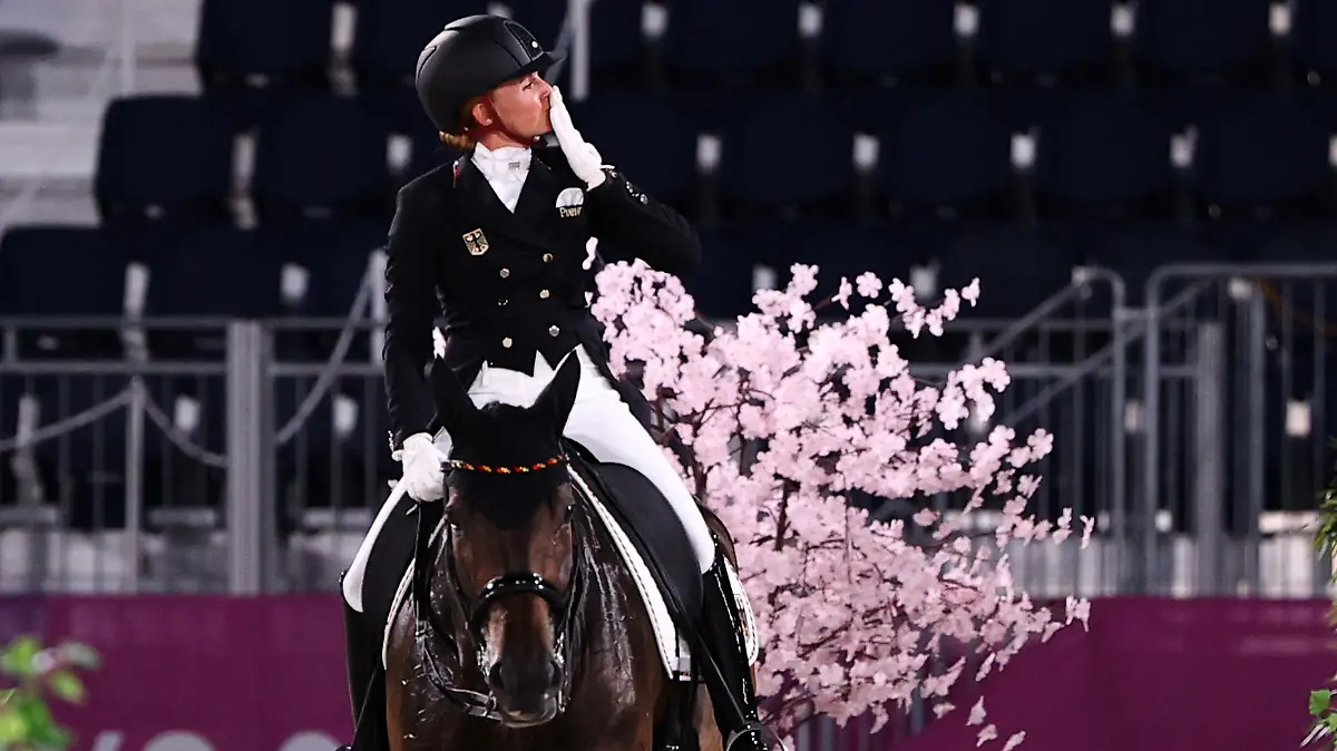 Tokyo 2020 Olympics - Dressage - Individual - Grand Prix - Day 1 - Groups A/B/C - Equestrian Park - Tokyo, Japan - July 24, 2021. Jessica von Bredow-Werndl of Germany on her horse TSF Dalera reacts after competing. REUTERS/Alkis Konstantinidis