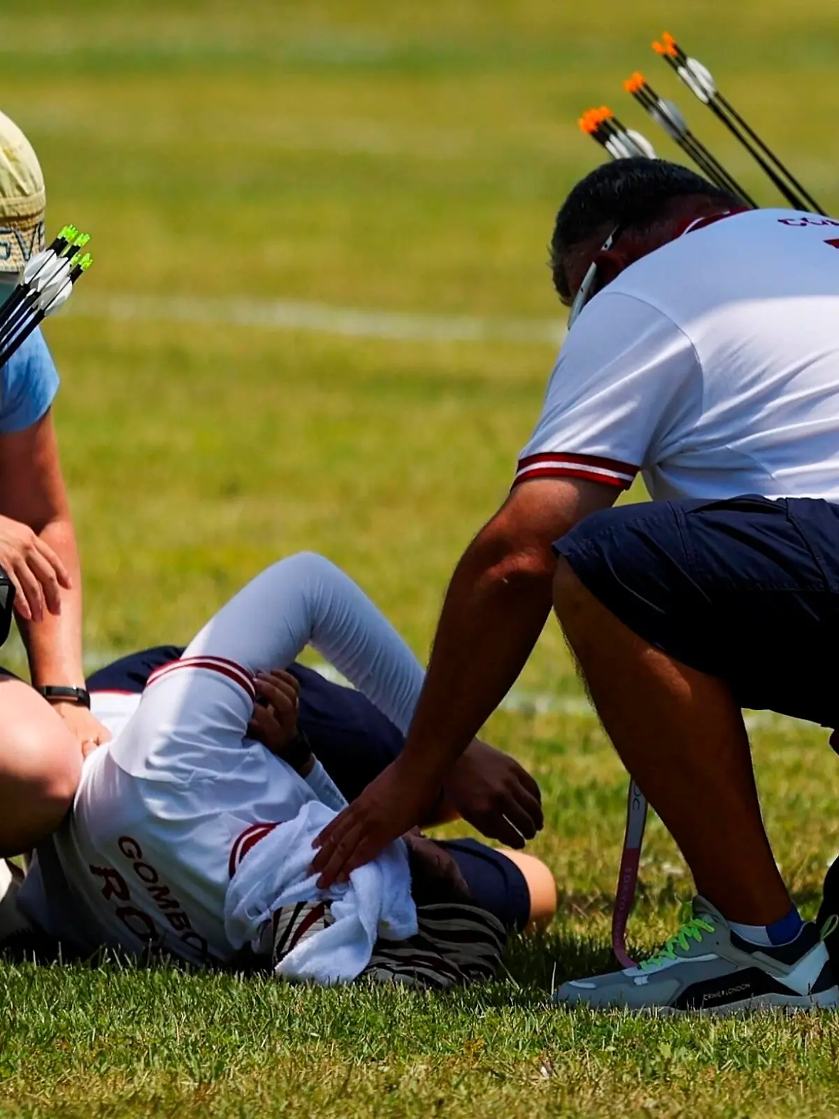 Svetlana Gomboeva bottom from the Russian Olympic Committee ROC receives medical attention during the women s individual Archery ranking round amid the 2020 Olympic Games, Olympische Spiele, Olympia, OS at the Yumenoshima field in Tokyo, Japan, 23 July 2021. Tokyo hosts the thirty-second Olympic Games from 23 July to 08 August 2021. Archery - Women s Individual Ranking Round ACHTUNG: NUR REDAKTIONELLE NUTZUNG PUBLICATIONxINxGERxSUIxAUTxONLY Copyright: xMiguelxGutierrezx EVE488 20210723-932df621d5c45ec9c182255f15adc35fb36b602b 