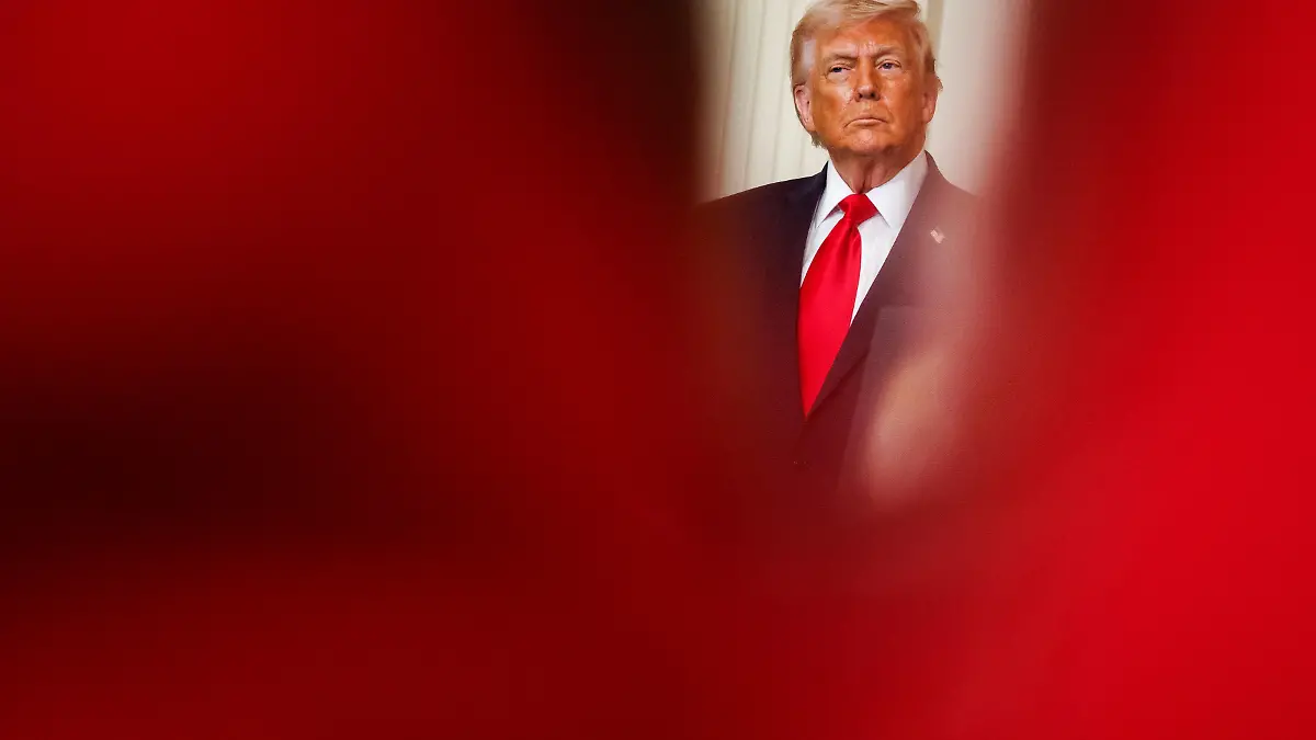 U.S. President Donald Trump listens as First Lady Melania Trump (not pictured) speaks during a Womens History Month event in the East Room of the White House on March 12, 2026 in Washington, D.C. (Photo by Samuel Corum/Sipa USA)