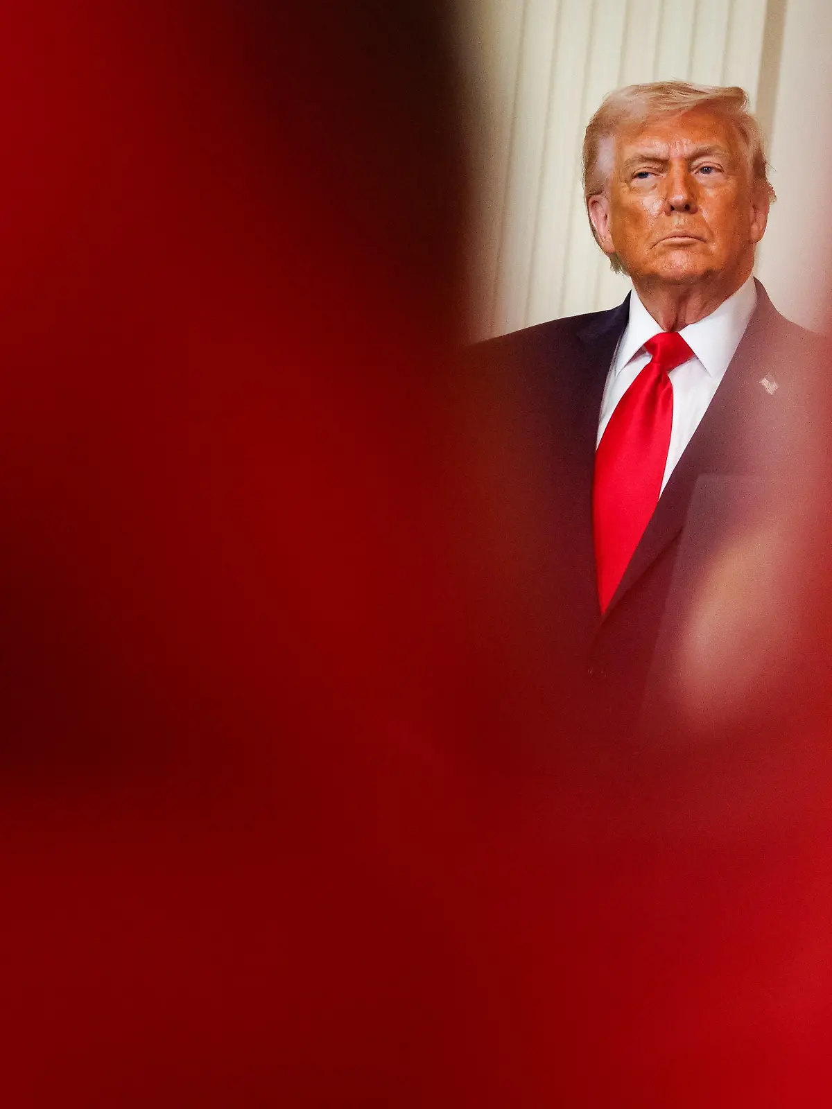 U.S. President Donald Trump listens as First Lady Melania Trump (not pictured) speaks during a Womens History Month event in the East Room of the White House on March 12, 2026 in Washington, D.C. (Photo by Samuel Corum/Sipa USA)