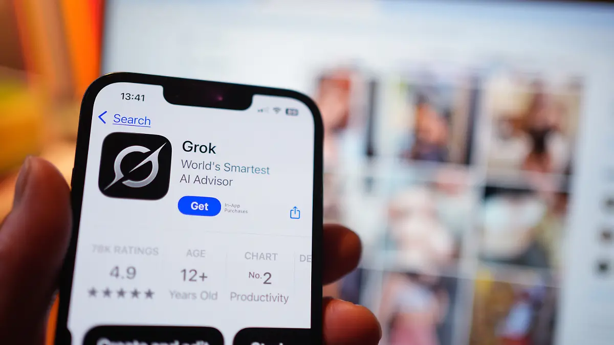 Deepfake concerns. File photo dated 08/01/26 of the AI app Grok on the App Store on an iPhone, against a backdrop of search results displayed on the social media platform X (formerly Twitter) on a laptop. Ofcom has launched a formal investigation into whether the social media platform X has complied with UK laws after reports its AI chatbot Grok created and shared sexualised images of children, the regulator has said. Issue date: Monday January 12, 2026. Photo credit should read: Yui Mok/PA Wire URN:83026468