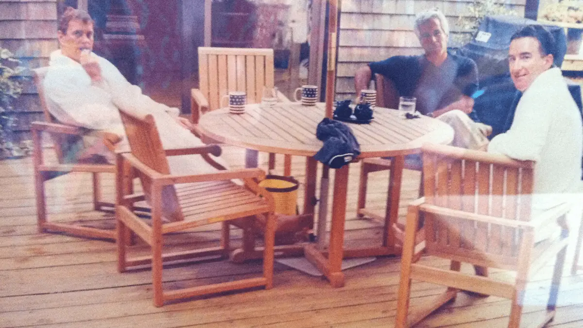 This undated photo in an unidentified location provided by the US Department of Justice on March 13, 2026 shows, Andrew Mountbatten-Windsor and Lord Peter Mandelson wearing bathrobes seated alongside late financier and convicted sex offender Jeffrey Epstein. Epstein Files Transparency Act (EFTA) passed by Congress and signed into law by US President Donald Trump mandated the complete release of the Epstein files by December 19, 2025. (Photo by Handout / US Department of Justice / AFP) / RESTRICTED TO EDITORIAL USE - MANDATORY CREDIT "AFP PHOTO / US Department of Justice" - HANDOUT - NO MARKETING NO ADVERTISING CAMPAIGNS - DISTRIBUTED AS A SERVICE TO CLIENTS