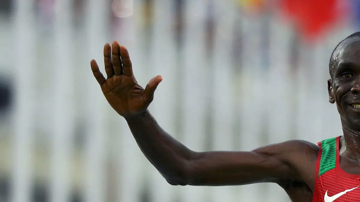 FILE PHOTO: 2016 Rio Olympics - Athletics - Final - Men's Marathon - Sambodromo - Rio de Janeiro, Brazil - 21/08/2016. Eliud Kipchoge (KEN) of Kenya crosses the finish line to win gold. REUTERS/Athit Perawongmetha/File Photo
