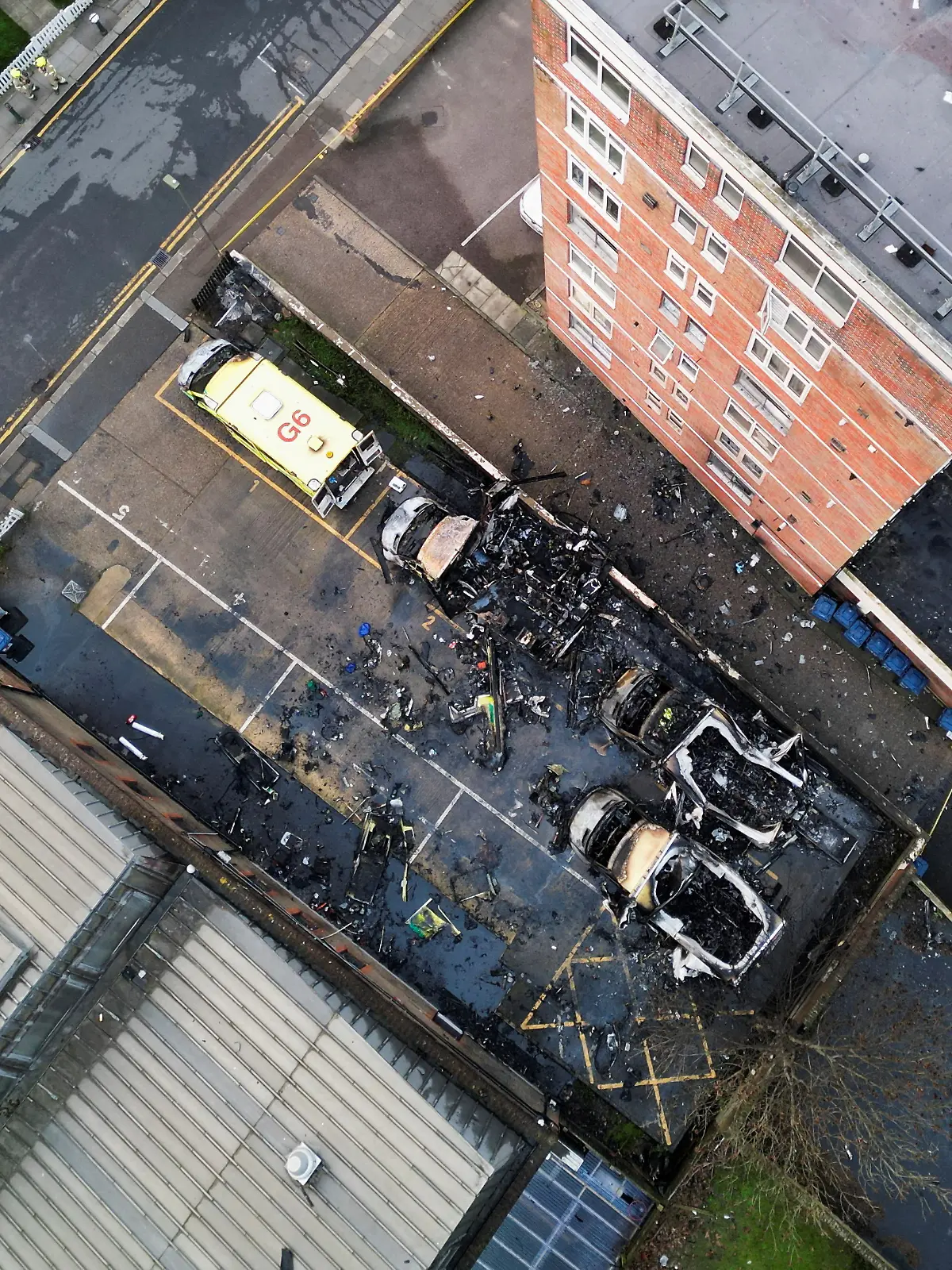 A drone view of four ambulances belonging to Hatzola, a Jewish community organisation, that were set on fire in an incident that the police say is being treated as an antisemitic hate crime, in northwest London, Britain, March 23, 2026. REUTERS/Hannah McKay     TPX IMAGES OF THE DAY