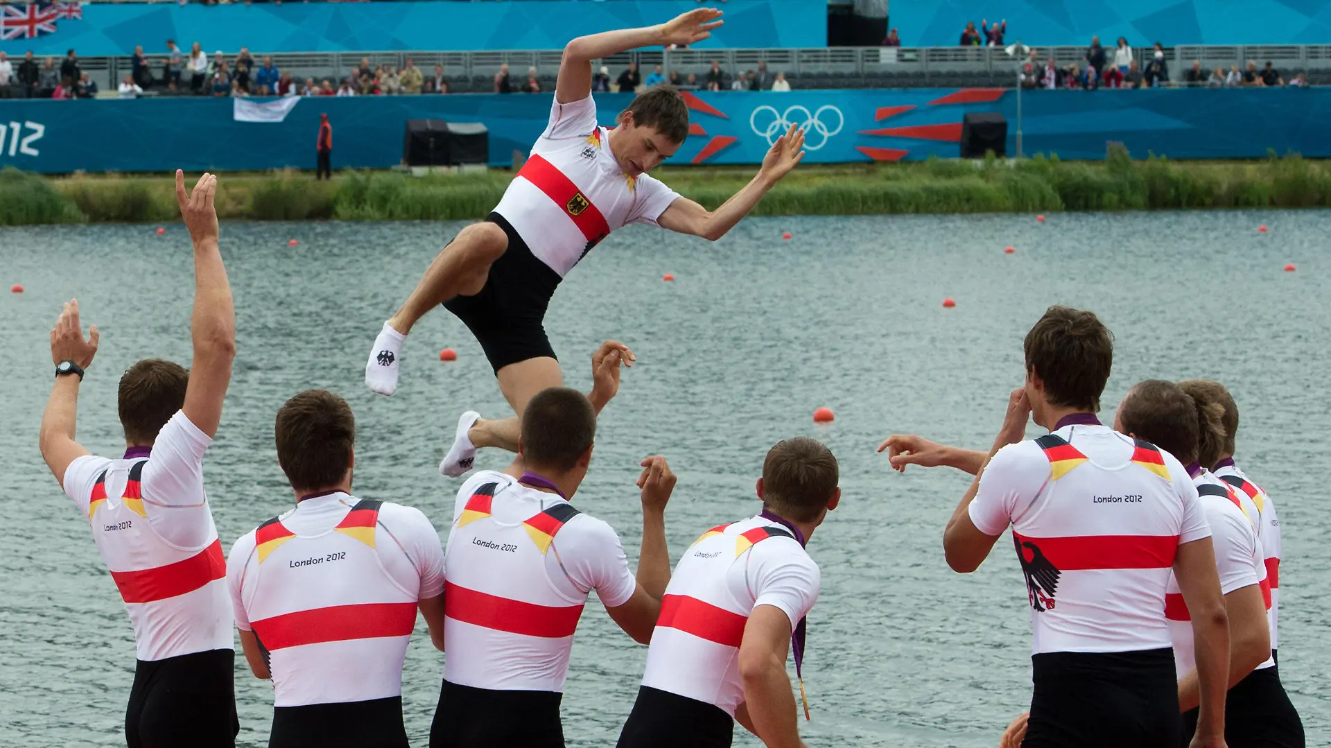Filip Adamski, Andreas Kuffner, Eric Johannesen, Maximilian Reinelt, Richard Schmidt, Lukas Mueller, Florian Mennigen, Kristof Wilke, Martin Sauer (top) of Germany celebrate after winning the Men's Eight Finals of the Rowing competition in Eton Dorney at the London 2012 Olympic Games, London, Great Britain, 01 August 2012. Photo: Peter Kneffel dpa  +++(c) dpa - Bildfunk+++