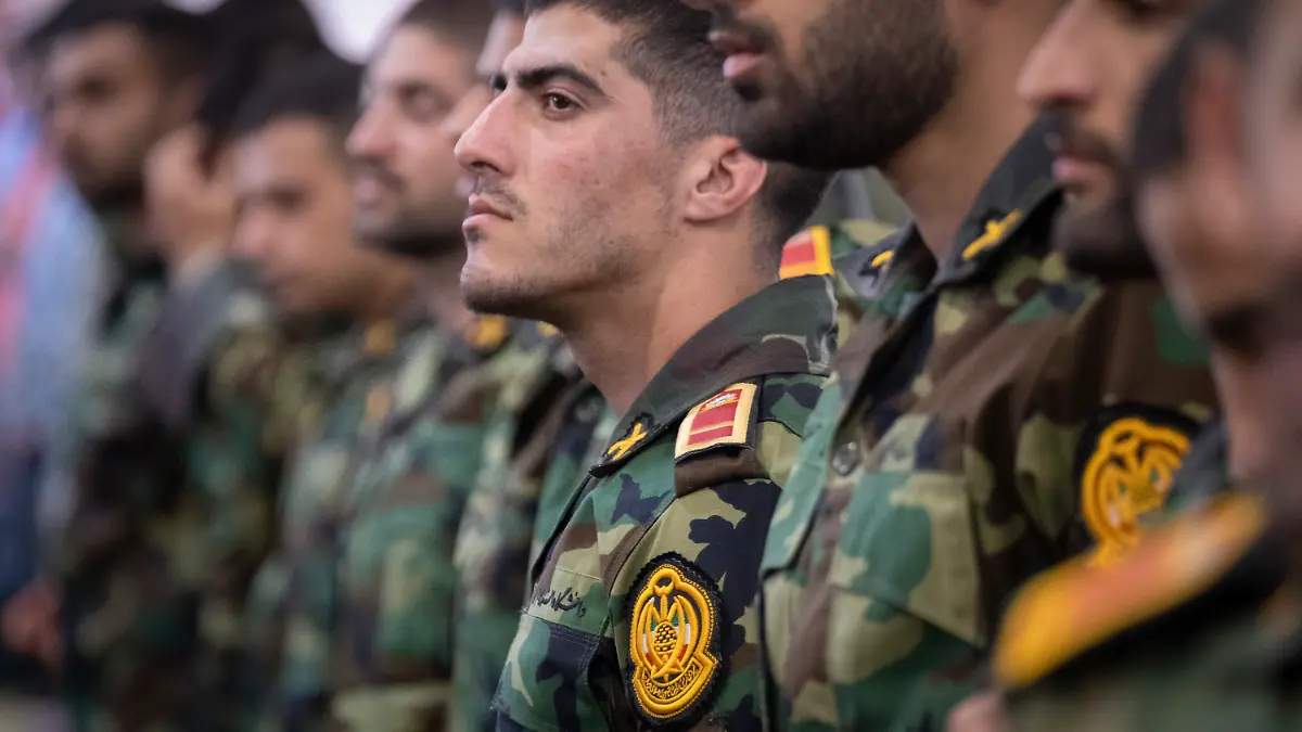 Iranian Army Ground Force military personnel participate in a Friday prayers ceremony at the University of Tehran in Tehran, Iran, on April 11, 2025. (Photo by Morteza Nikoubazl/NurPhoto)