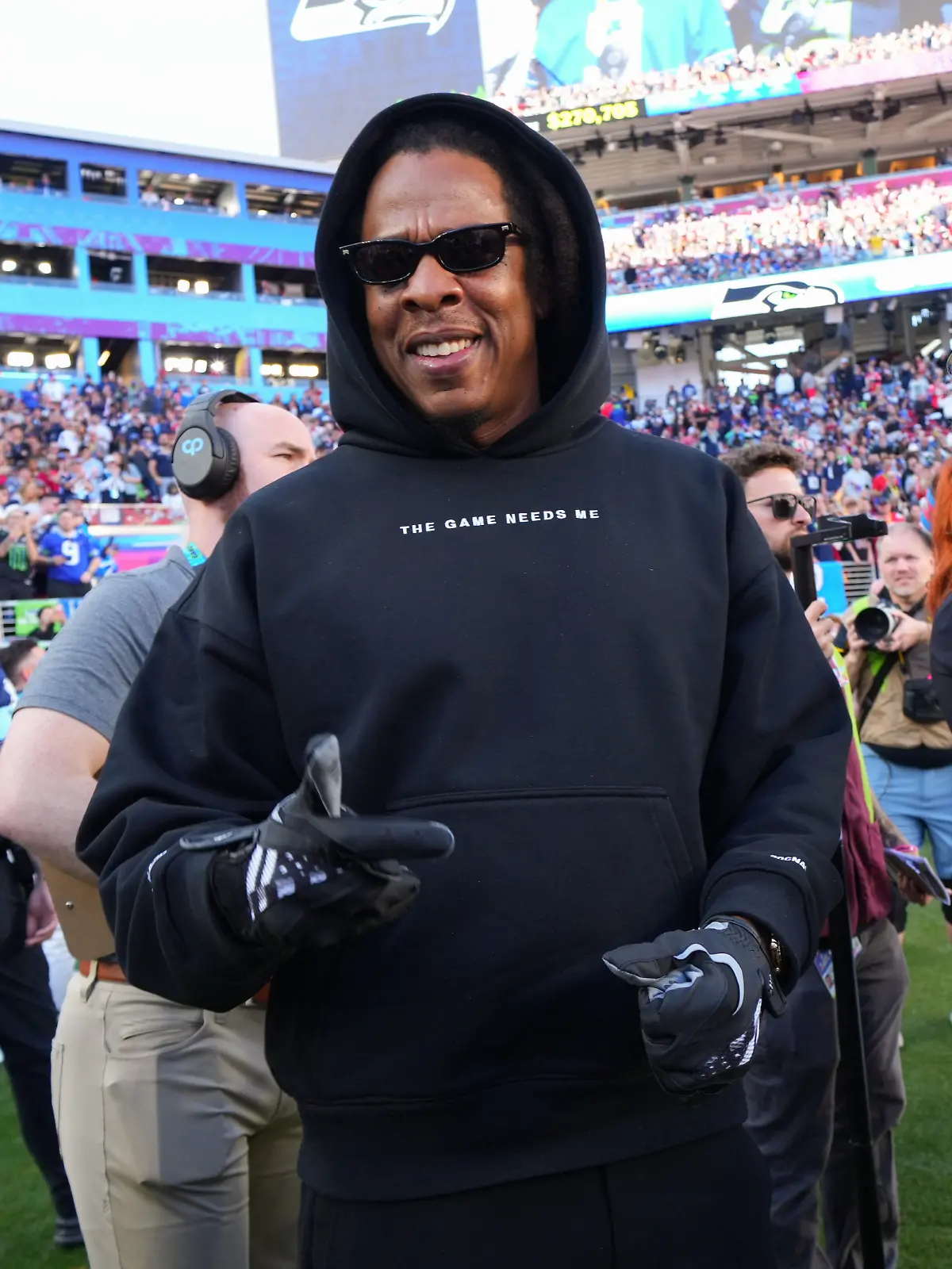 Jay-Z walks on the field before the NFL Super Bowl 60 football game between the New England Patriots and the Seattle Seahawks, Sunday, Feb. 8, 2026, in Santa Clara, Calif. (AP Photo/Julio Cortez)