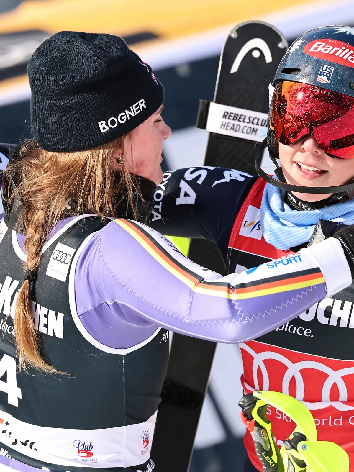 Germany's Emma Aicher, left, and United States' Mikaela Shiffrin hug each other at the finish area of an alpine ski, women's slalom race, at the Lillehammer World Cup Finals, in Hafjell, Norway, Tuesday, March 24, 2026. (AP Photo/Marco Trovati)