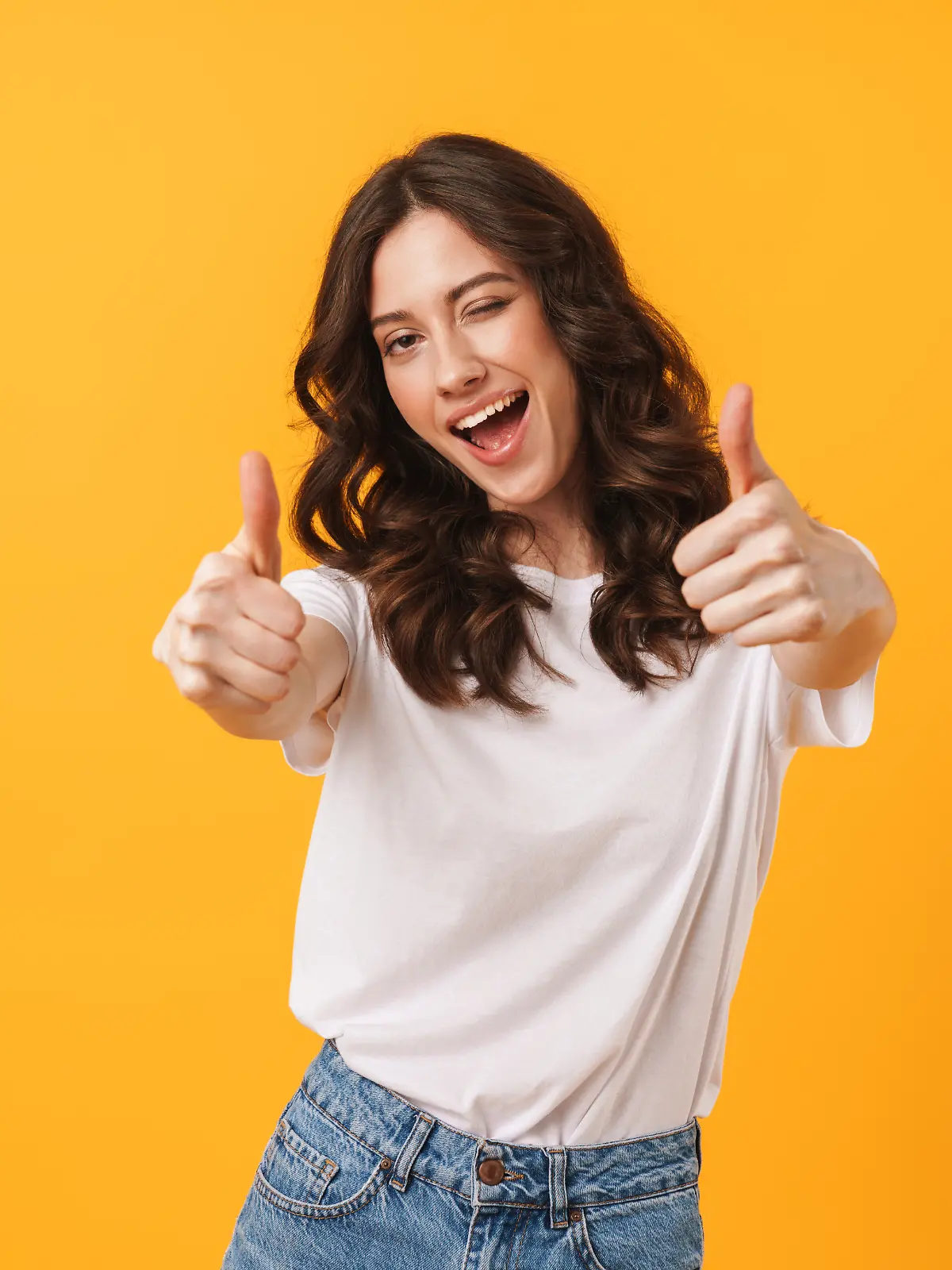 Image of beautiful brunette woman wearing casual clothes winking