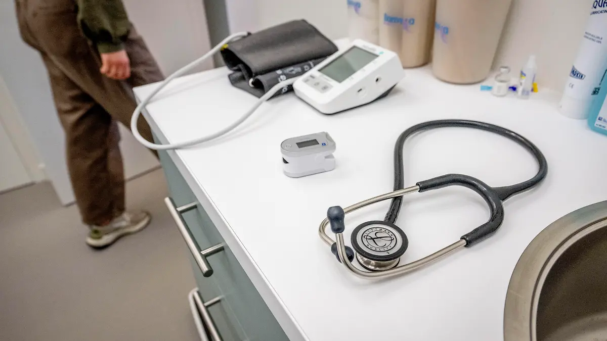 ILLUSTRATIVE - A general practitioner examines a patient during a visit to the iROBIN UTRECHT GP practice