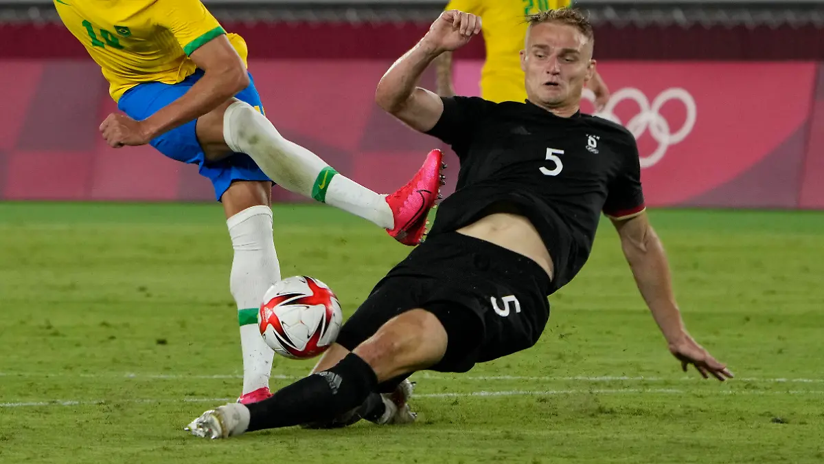 Germany's Amos Pieper blocks Brazil's Richarlison during a men's soccer match at the 2020 Summer Olympics, Thursday, July 22, 2021, in Yokohama, Japan. (AP Photo/Kiichiro Sato)