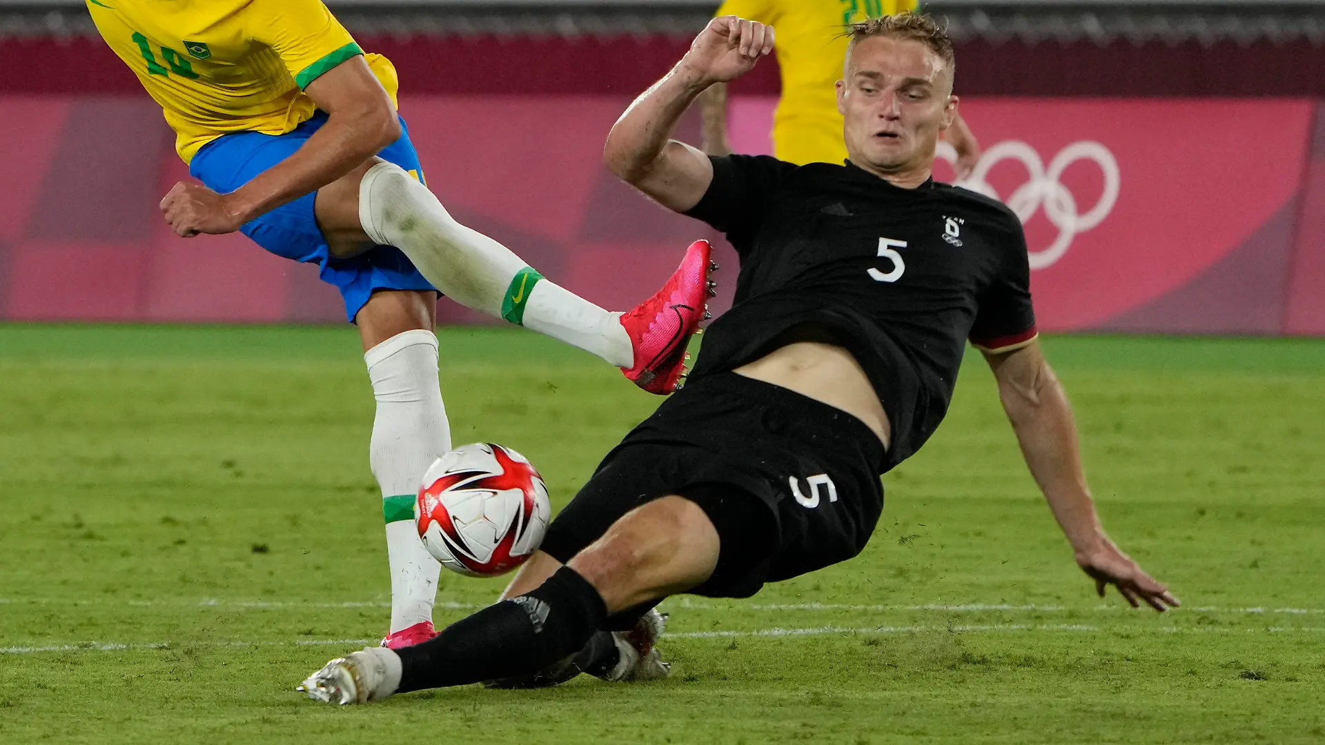 Germany's Amos Pieper blocks Brazil's Richarlison during a men's soccer match at the 2020 Summer Olympics, Thursday, July 22, 2021, in Yokohama, Japan. (AP Photo/Kiichiro Sato)