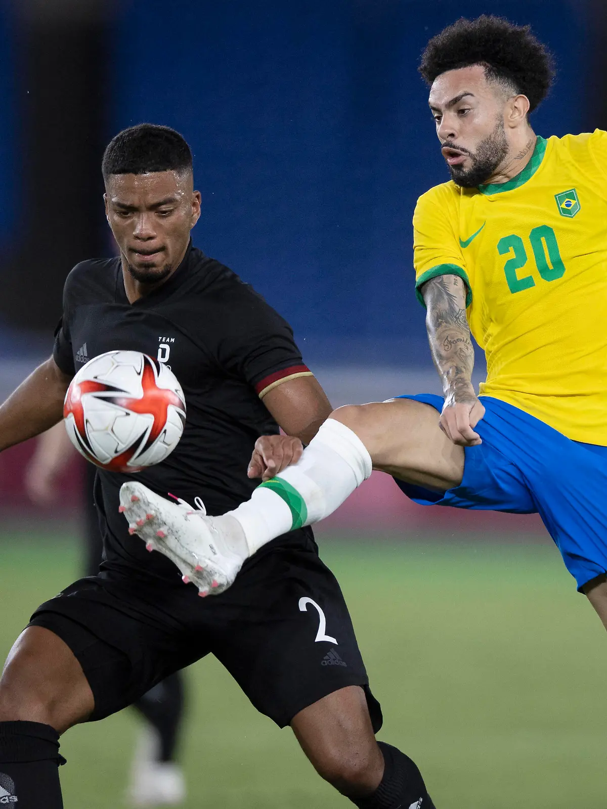  22nd July 2021 Stadium Yokohama, Yokohama, Japan Tokyo 2020 Olympic Games, Olympische Spiele, Olympia, OS Brazil versus Germany Claudinho of Brazil pokes the ball away from Benjamin Henrichs of Germany PUBLICATIONxNOTxINxUK ActionPlus12307805 LucasxFigueiredo/CBF