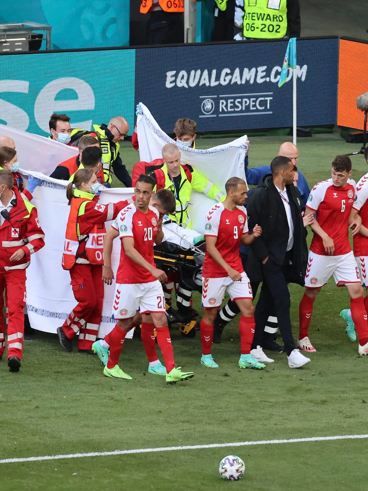 Paramedics using a stretcher to take out of the pitch Denmark's Christian Eriksen after he collapsed during the Euro 2020 soccer championship group B match between Denmark and Finland at Parken stadium in Copenhagen, Denmark, Saturday, June 12, 2021. (Wolfgang Rattay/Pool via AP)