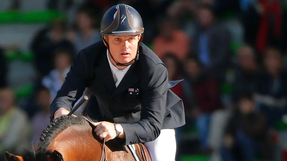 FILE - In this Sept. 3, 2014, file photo, Jamie Kermond of Australia, riding Quite Cassini competes during the second day of the team and individual qualifying show jumping event at the FEI World Equestrian Games in Caen, western France. Equestrian Australia said Wednesday, July 21, 2021, it had provisionally suspended Kermond, a member of the Olympic show jumping team over a positive test for cocaine. (AP Photo/Michel Euler, File)