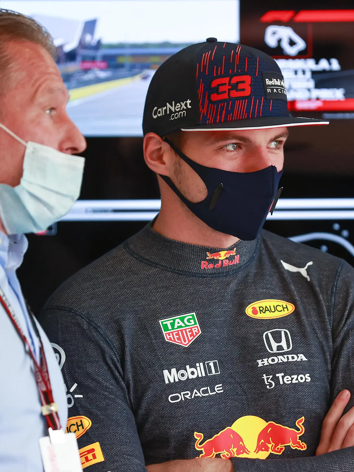 NORTHAMPTON, ENGLAND - JULY 17: Max Verstappen of Netherlands and Red Bull Racing talks with his father Jos Verstappen in the garage before the Sprint for the F1 Grand Prix of Great Britain at Silverstone on July 17, 2021 in Northampton, England. (Photo by Mark Thompson/Getty Images)