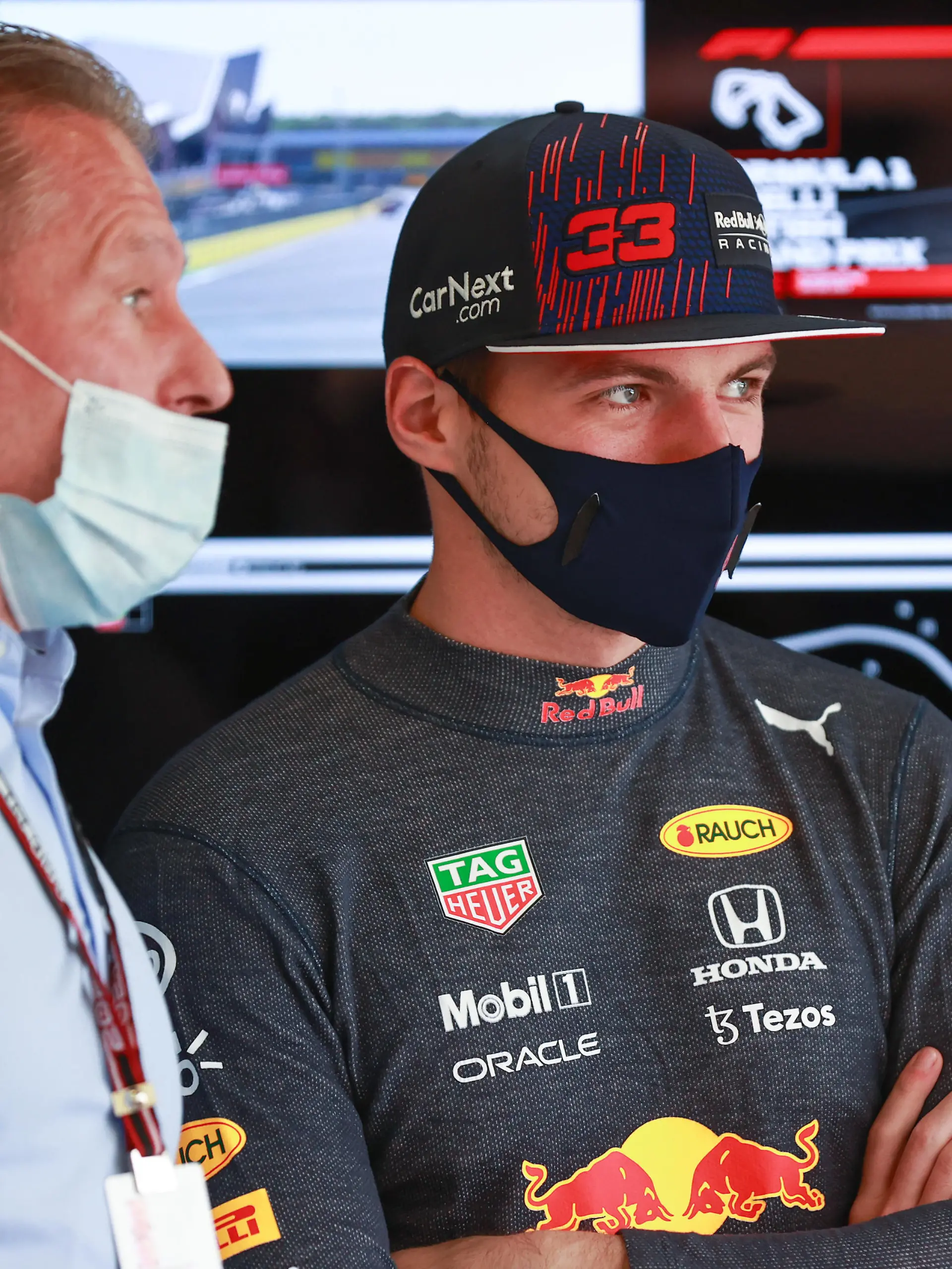 NORTHAMPTON, ENGLAND - JULY 17: Max Verstappen of Netherlands and Red Bull Racing talks with his father Jos Verstappen in the garage before the Sprint for the F1 Grand Prix of Great Britain at Silverstone on July 17, 2021 in Northampton, England. (Photo by Mark Thompson/Getty Images)