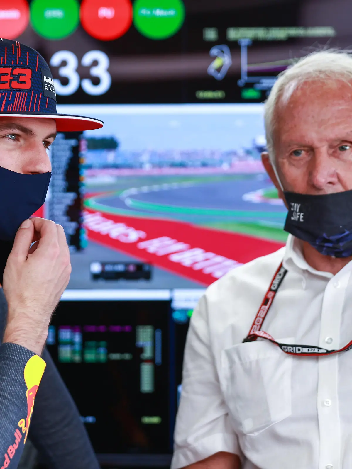 NORTHAMPTON, ENGLAND - JULY 17: Max Verstappen of Netherlands and Red Bull Racing and Red Bull Racing Team Consultant Dr Helmut Marko look on in the garage during practice ahead of the F1 Grand Prix of Great Britain at Silverstone on July 17, 2021 in Northampton, England. (Photo by Mark Thompson/Getty Images)