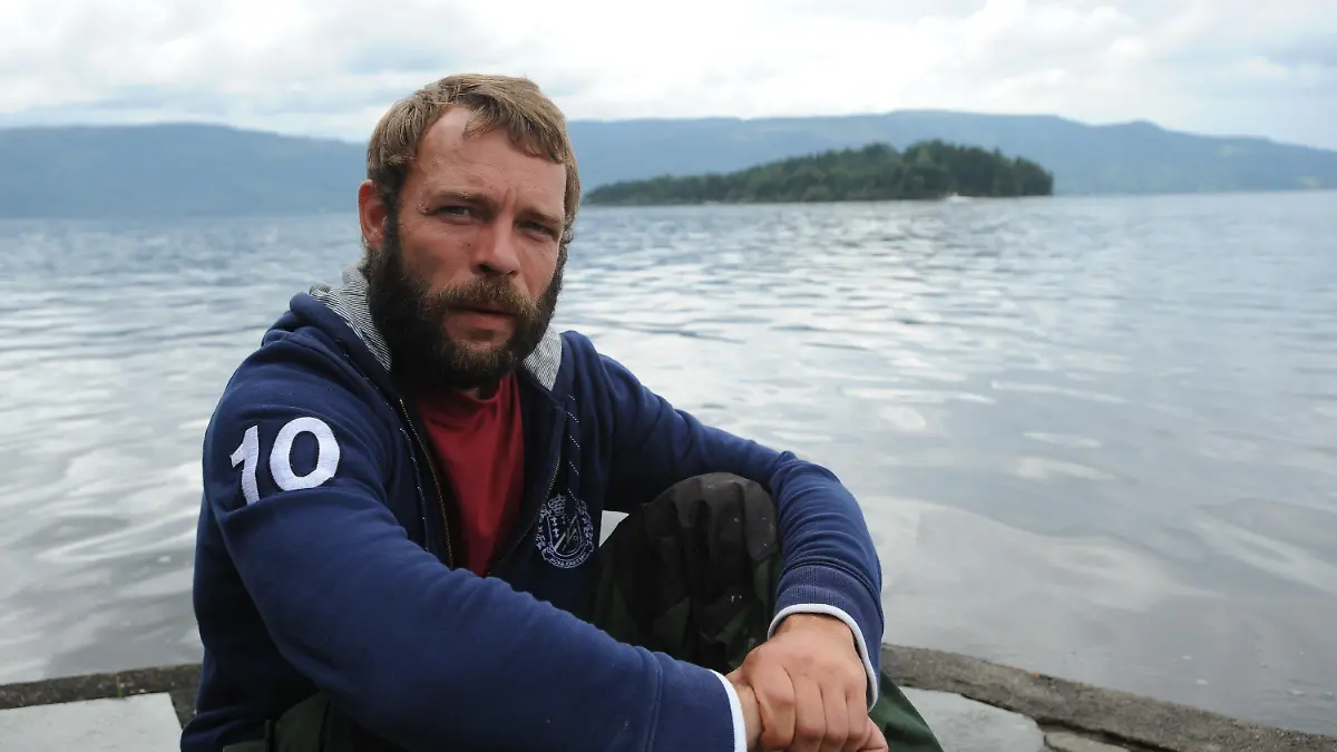 German Marcel Gleffe sits on Utvika camping ground in front of Utoya island, Norway, 24 July 2011. With his boat Gleffe saved the lives of many young people during the shooting spree on Utoya island July 22. The bombing of government buildings in Oslo and the subsequent shooting spree at a political youth camp on Utoya island on 22 July 2011 have claimed more than 90 lives with the death toll still feared to rise. Photo: Britta Pedersen dpa  +++(c) dpa - Bildfunk+++